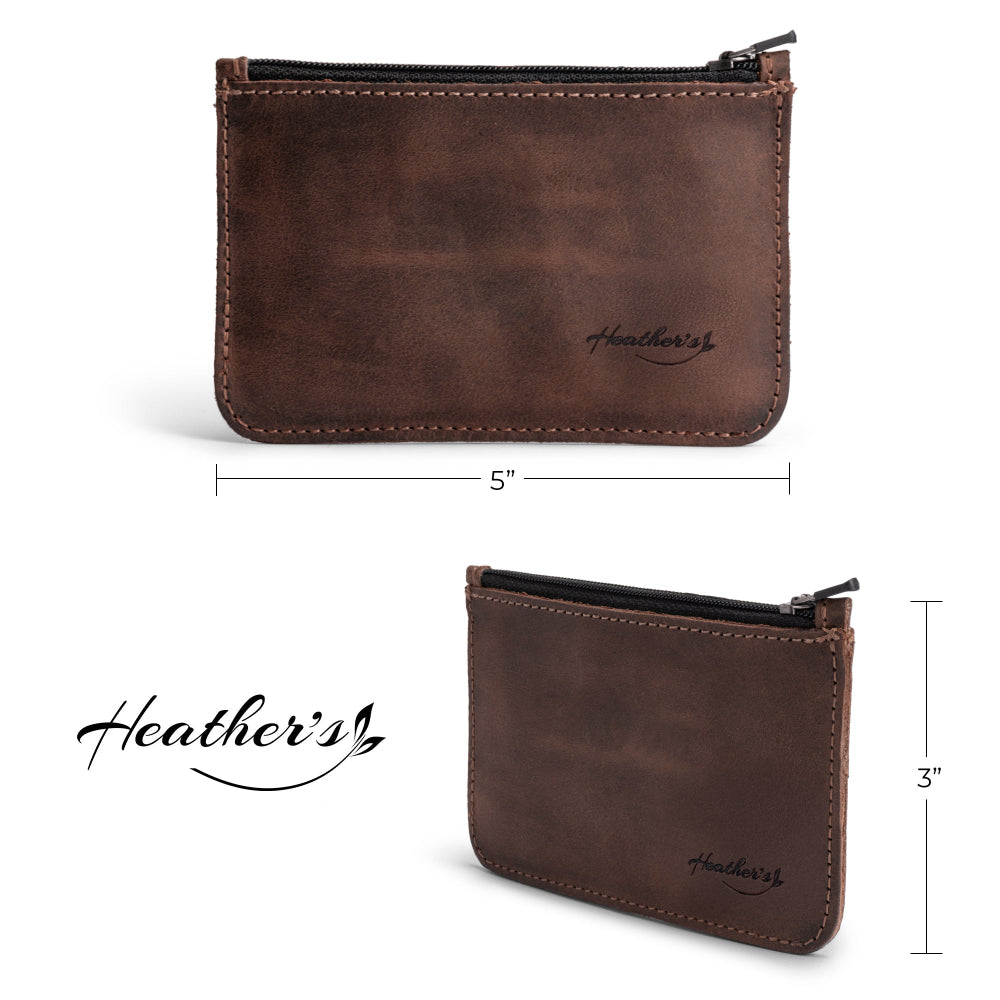 Heather's Zippered Half Wallet shown with a card for reference, emphasizing its compact size of 5x3 inches. This artisan wallet, made from full grain leather, is designed for functionality, holding up to 6 cards, folded bills, and coins. A stylish addition to travel pouches and everyday accessories.