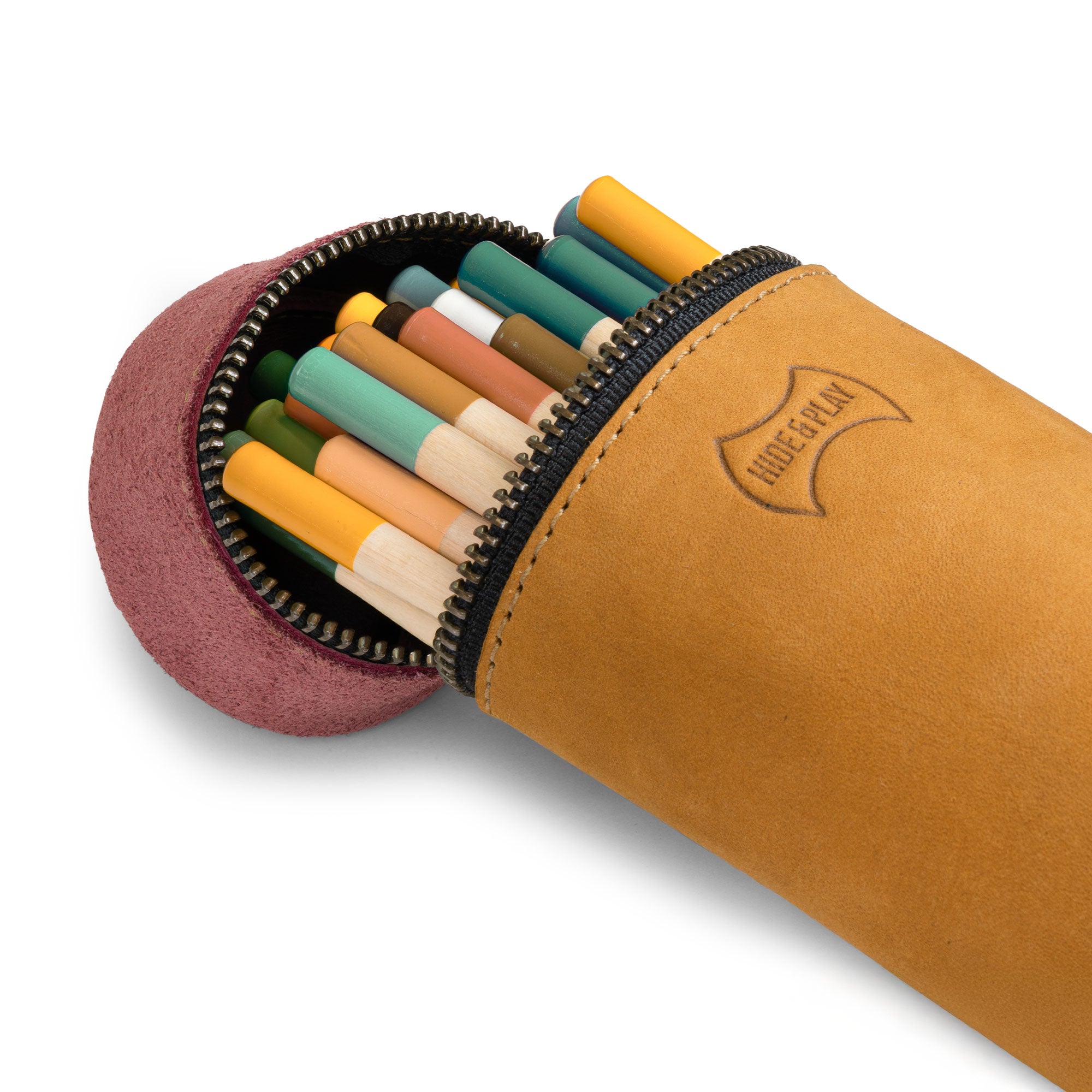 The versatile Pencil-Shaped Case by Hide & Play offers stylish storage for pens, pencils, and markers. Its zippered closure and full grain leather construction highlight small batch production and artisan detail, made by hand in La Antigua Guatemala & Oaxaca Mexico.