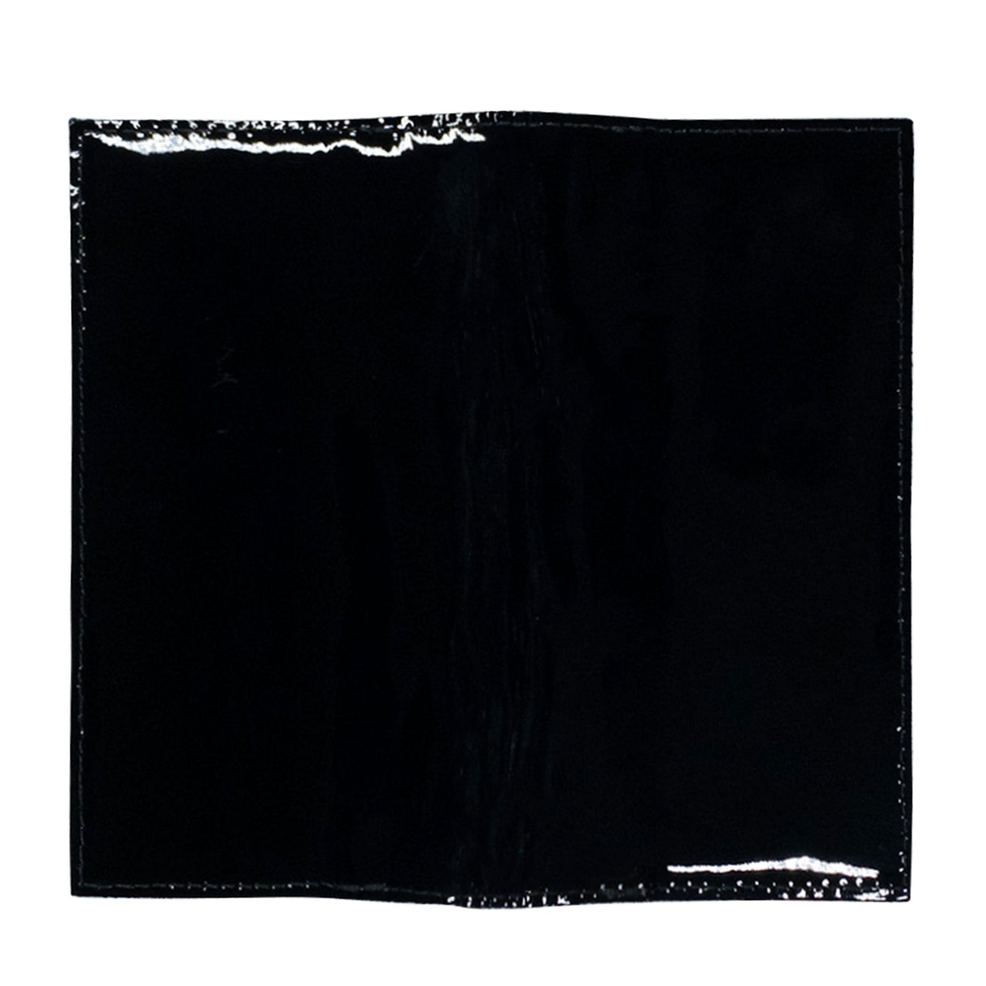 Checkbook Leather Cover by Hide & Drink displayed in a rich color, designed as a minimalist organizer for standard checkbooks. This handmade item is crafted from full grain leather, reflecting artisan skills in La Antigua Guatemala and Oaxaca Mexico, showcasing small batch production.