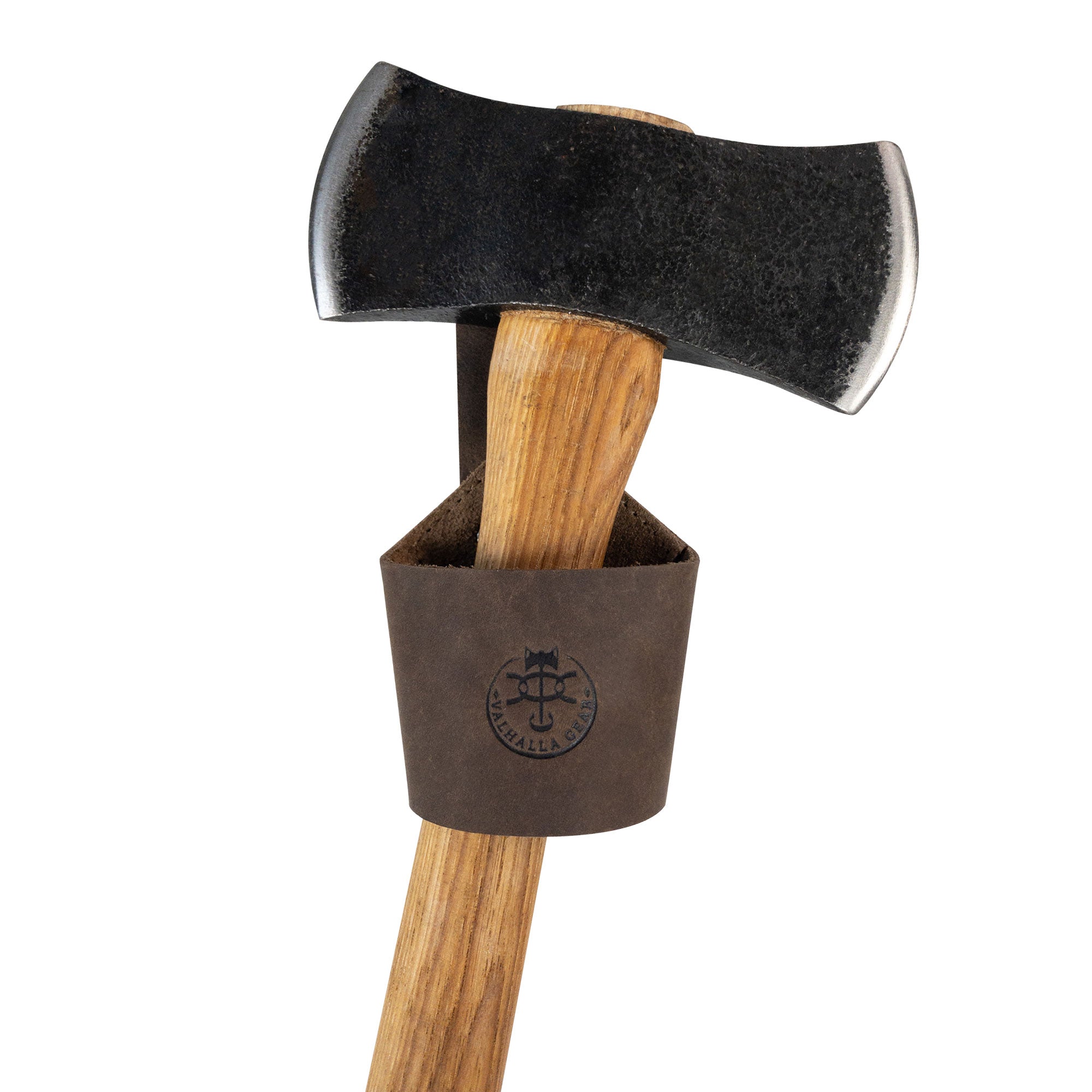 Valhalla Gear's Single Axe Holster features a close-up of an axe snugly fitted into its durable leather case, showcasing the handmade details. This accessory for tools is built for convenience and safety while enhancing your home improvement tasks. Crafted from high-quality full grain leather in small batch production, each holster is hand cut and hand sewn, reflecting artisan skill from La Antigua Guatemala & Oaxaca Mexico.