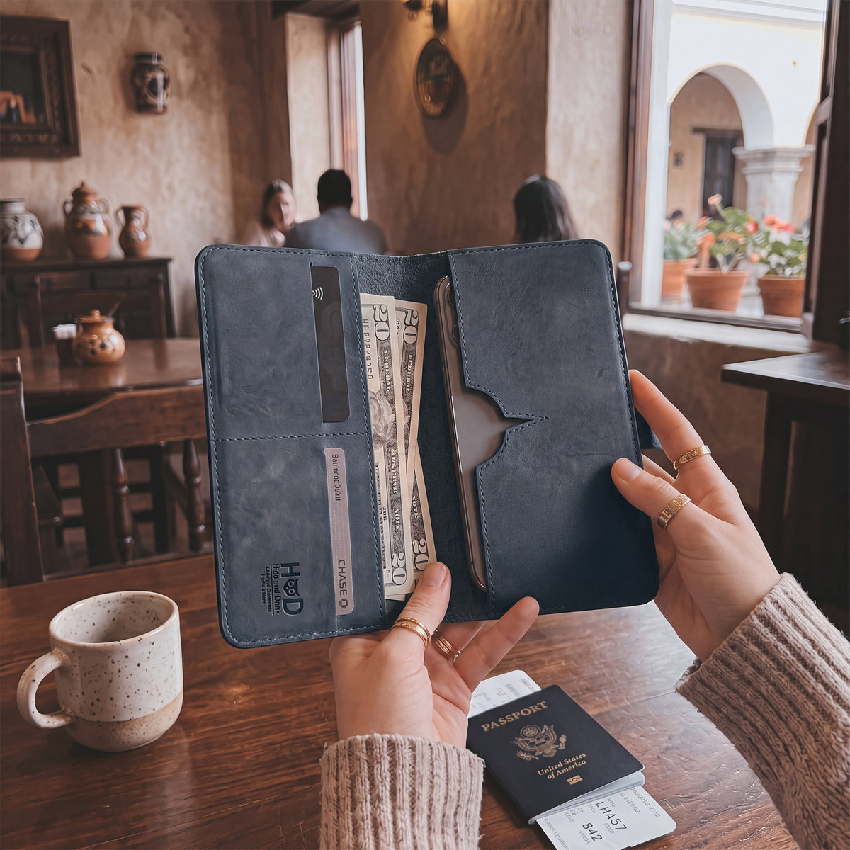 Exterior view of the closed bifold wallet for cellphone by Hide & Drink, highlighting its premium leather finish. This Bifold Wallet for Cellphone is designed for everyday convenience with a touch of elegance in Full Grain Leather. Experience the artisan craftsmanship from small batch production in La Antigua Guatemala &