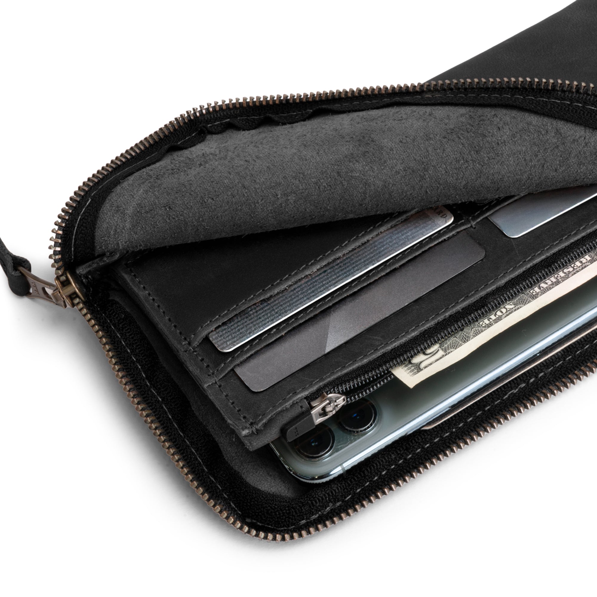 Interior layout of the Large Zippered Wallet by Hide & Drink, showcasing the pocket designs for secure storage. This Long Zippered Wallet for Men and Women functions well as a Card Holder, Card Organizer, and Bill Holder for all travel essentials. Produced in small batches, it is hand cut and hand sewn in La Antigua Guatemala & Oaxaca Mexico.