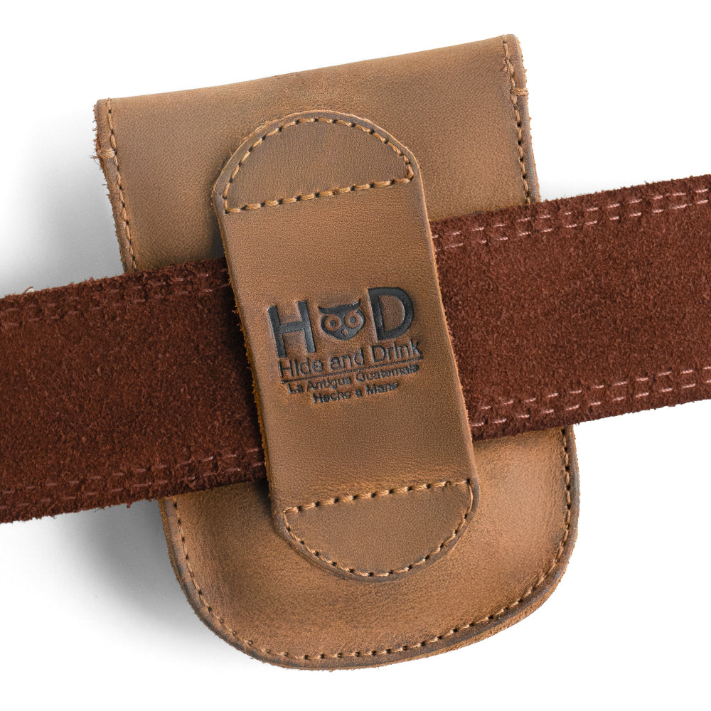 The Hide & Drink case is shown closed, demonstrating its practical design and durable material. This handcrafted, full-grain leather case is perfect for storing essential personal items.