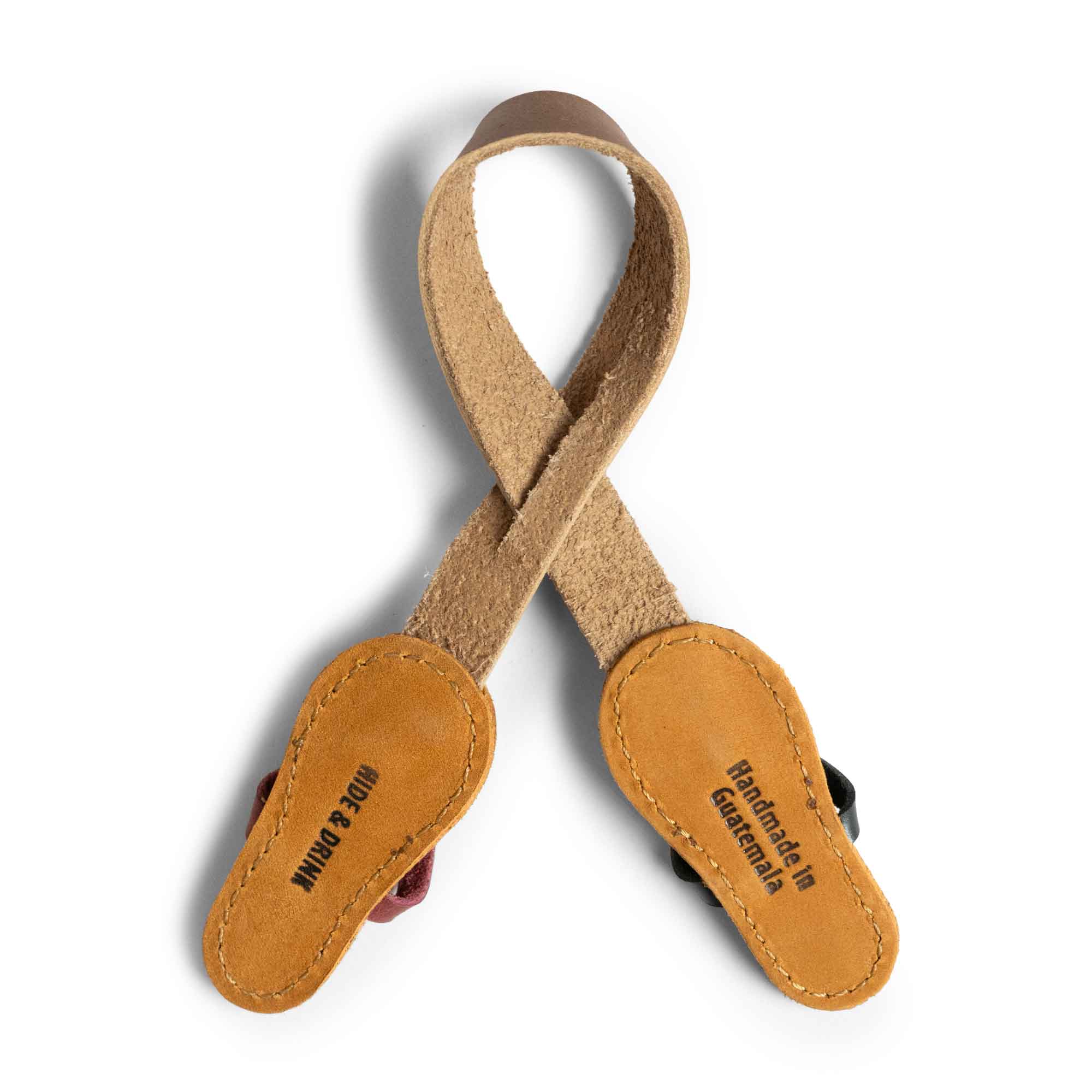 Hide & Drink Bag Charms featuring an intricately designed flip flop, perfect charm for handbags. Ideal as a purse charm for tote & backpacks, crafted using premium full grain leather. This piece signifies StockyardX's small batch production approach with hand cut, hand sewn precision, enhanced by fire branding, handmade in La Antigua Guatemala & Oaxaca Mexico.