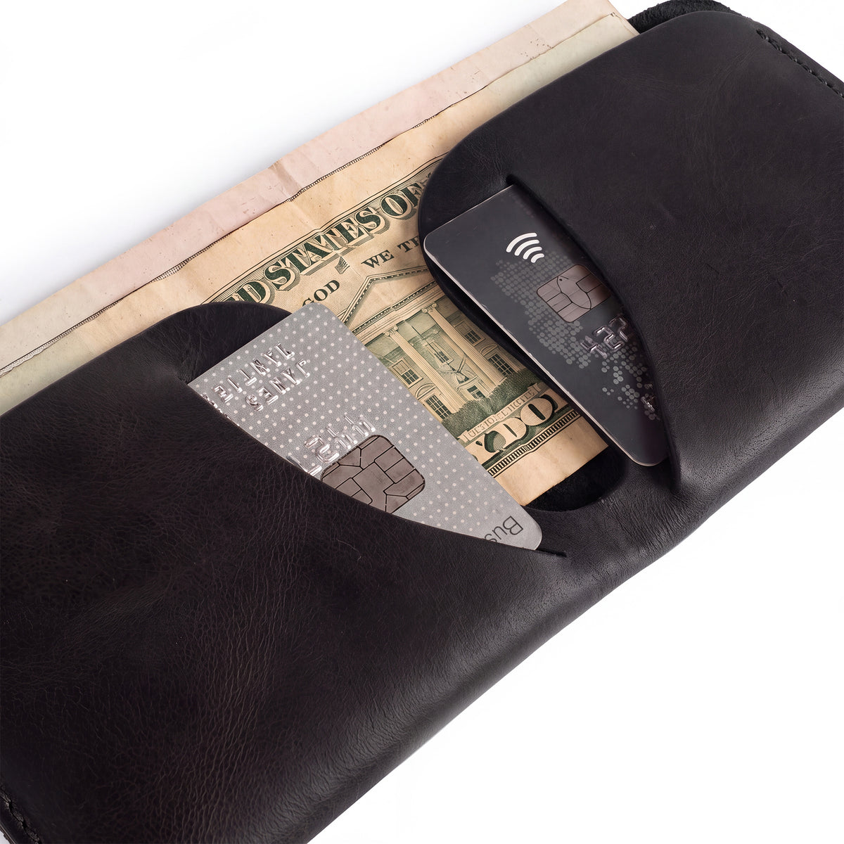 Dimensions of the Hide & Drink Minimal Wallet displayed beside a measuring scale. This sleek Full Grain Leather Classic Slimfold Wallet doubles as a Card Organizer Holder and Travel Accessory, crafted through Small Batch Production techniques by artisans from La Antigua Guatemala & Oaxaca Mexico.