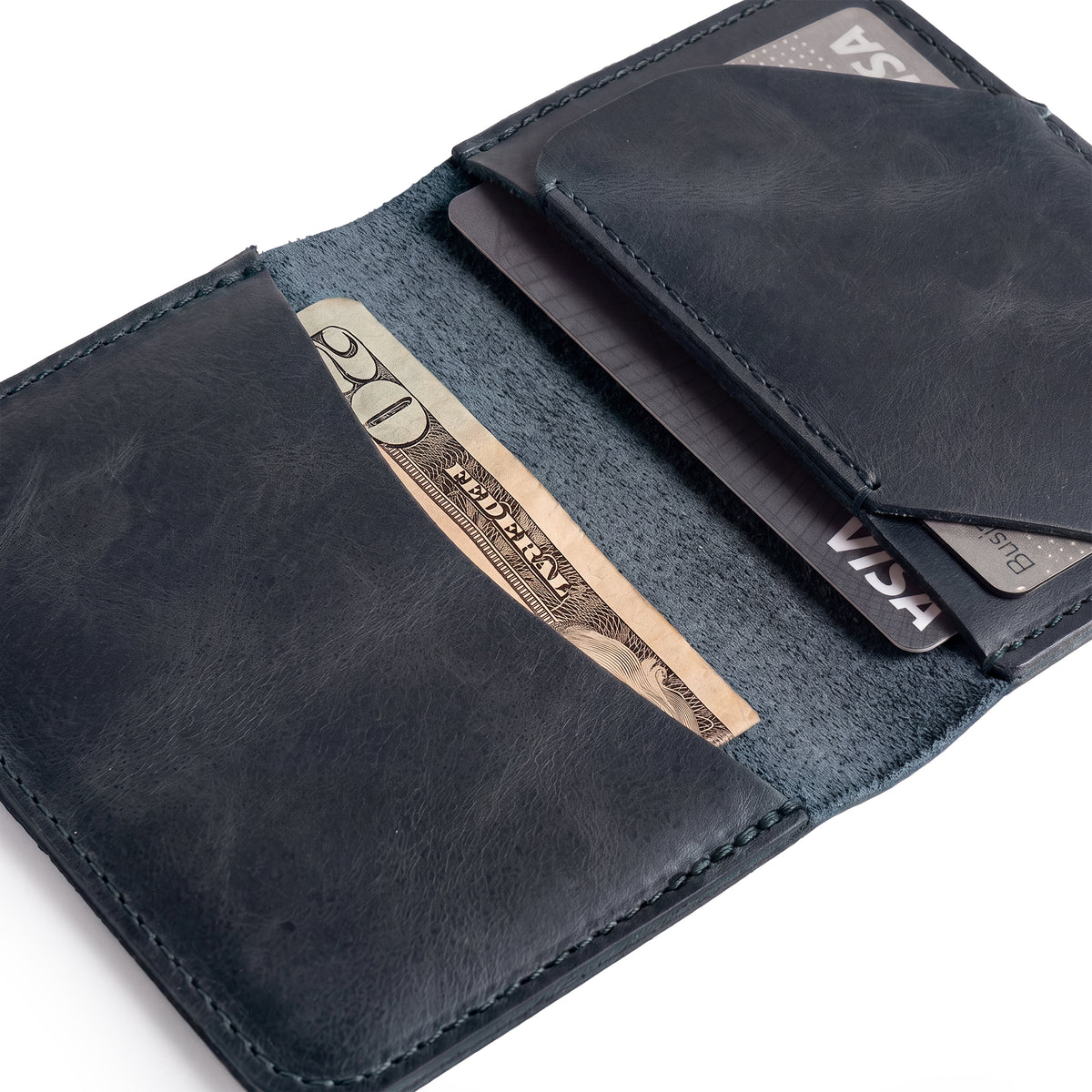 Open view of the Bi-Fold Card Wallet Diagonal by Hide & Drink in brown, illustrating its functionality as a stylish cash and card organizer made from durable leather.