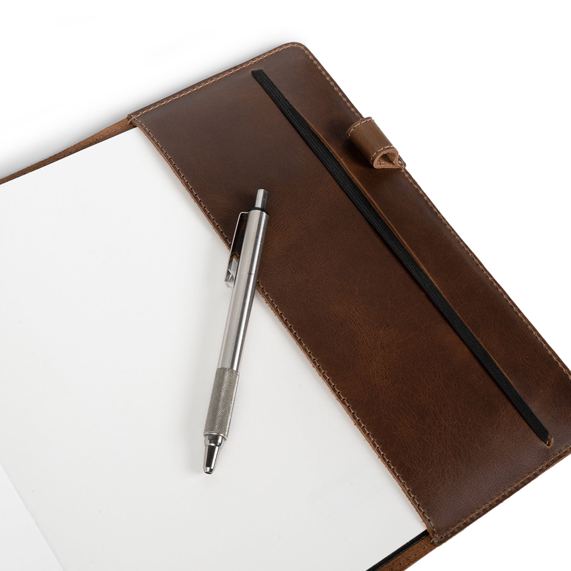 Close-up of the Cover for Leuchtturm1917 Sketchbook Hardcover Square Size (225 x 225 mm) by Hide & Drink, showcasing the pen slot and full grain leather craftsmanship. This journal cover is designed with small batch production in mind, featuring hand cut and hand sewn artistry, fire branded details, handmade in La Antigua Guatemala & Oaxaca Mexico.