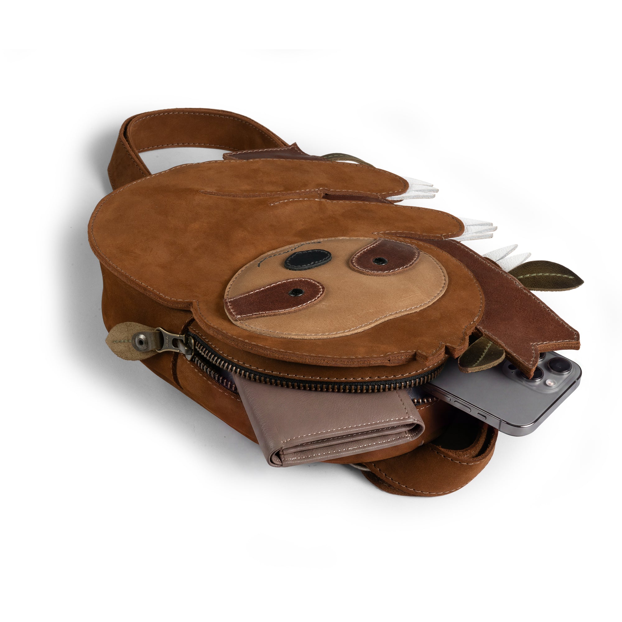Open view of the Leather Sloth Crossbody Bag by Tudi Frudi, showing the spacious interior perfect for daily essentials. This charming Sloth Crossbody Bag with Adjustable Shoulder Strap is an ideal option for those seeking a fashionable Messenger Bag or Purses for Men and Women, made from high-quality Full Grain Leather, crafted with care through Small Batch Production in La Antigua Guatemala & Oaxaca Mexico.