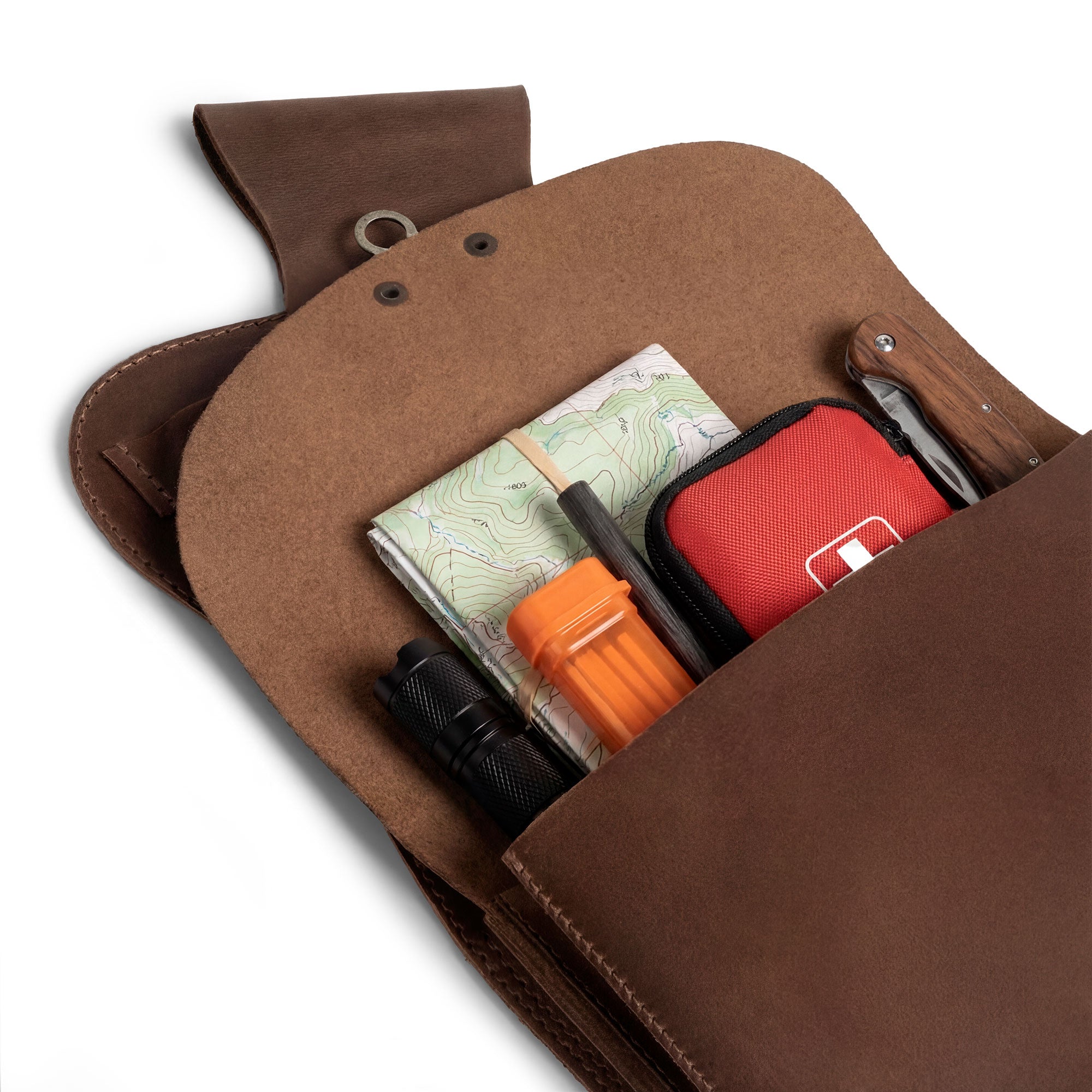 The Norseman, Hip Quiver by Valhalla Gear is seen from the inside, showcasing a spacious pocket that fits maps and tools. This hip archery quiver is crafted from full grain leather, offering handmade quality with fire branded details. Ideal for archery practice and outdoor adventures, this side pouch for archers is a reliable storage solution, handmade in La Antigua Guatemala & Oaxaca Mexico.