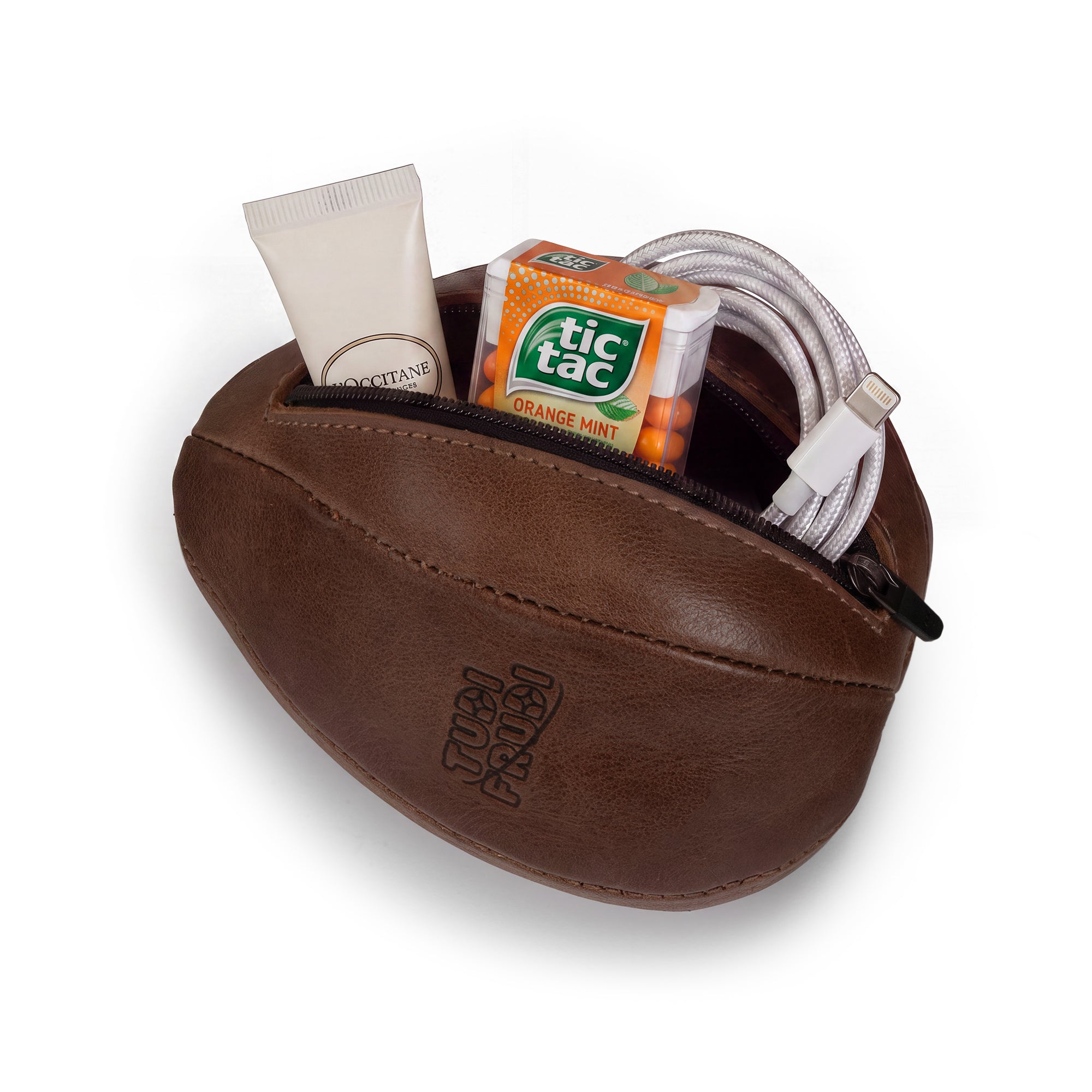 Open Tudi Frudi Dragon Egg Pouch holding toiletries, mints, and charging cables, made from Full Grain Leather with StockyardX Small Batch Production, Hand Cut and Hand Sewn construction, a Fire Branded logo, and Artisan craftsmanship Handmade in La Antigua Guatemala & Oaxaca Mexico.