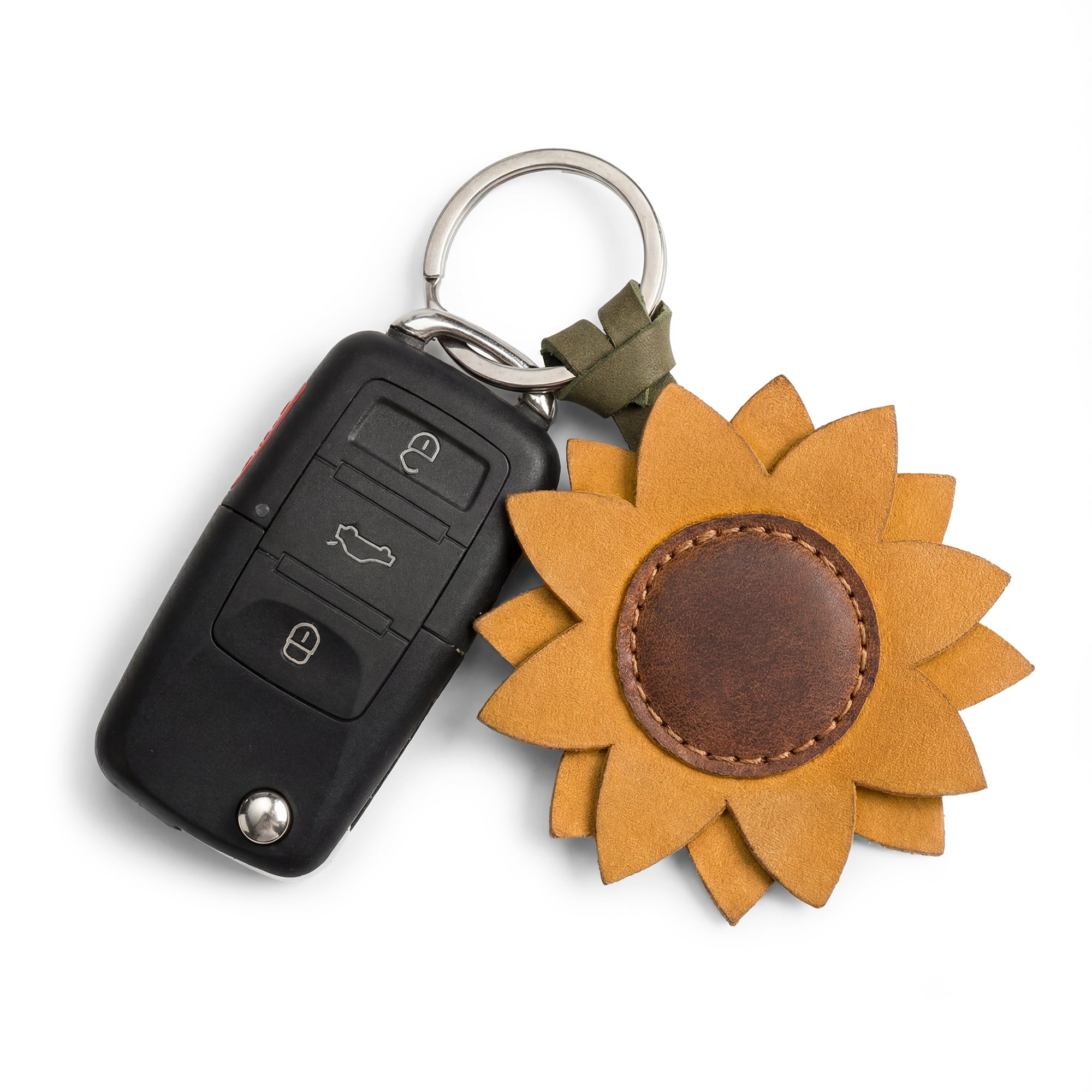 Close-up of Hide & Drink’s Sunflower Keychain featuring a sunflower design in full grain leather, perfect as a stylish accessory for keyring attachment, handmade with care.