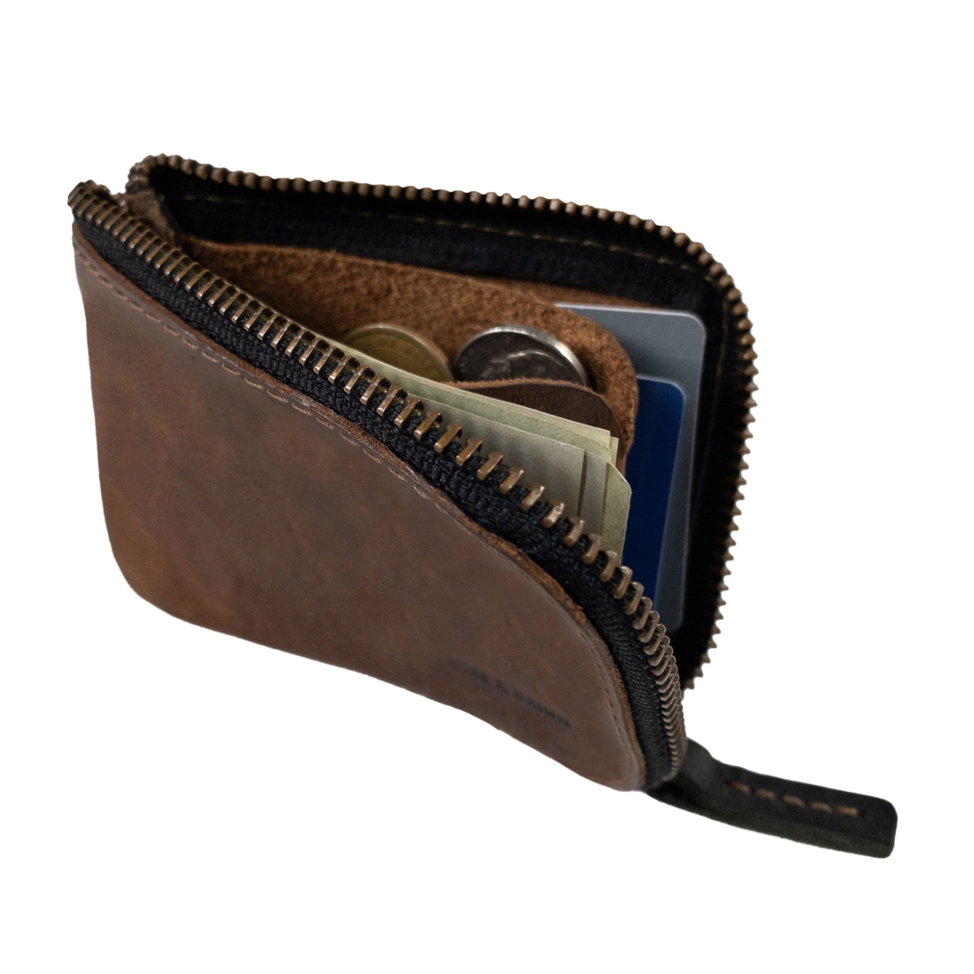 The interior of a Hide & Drink Card Pocket Wallet showing its storage capabilities. This zippered card wallet for men and women doubles as a coin pouch and money holder, made from full grain leather. Artisan-crafted in La Antigua Guatemala, it ensures quality with small batch production methods.