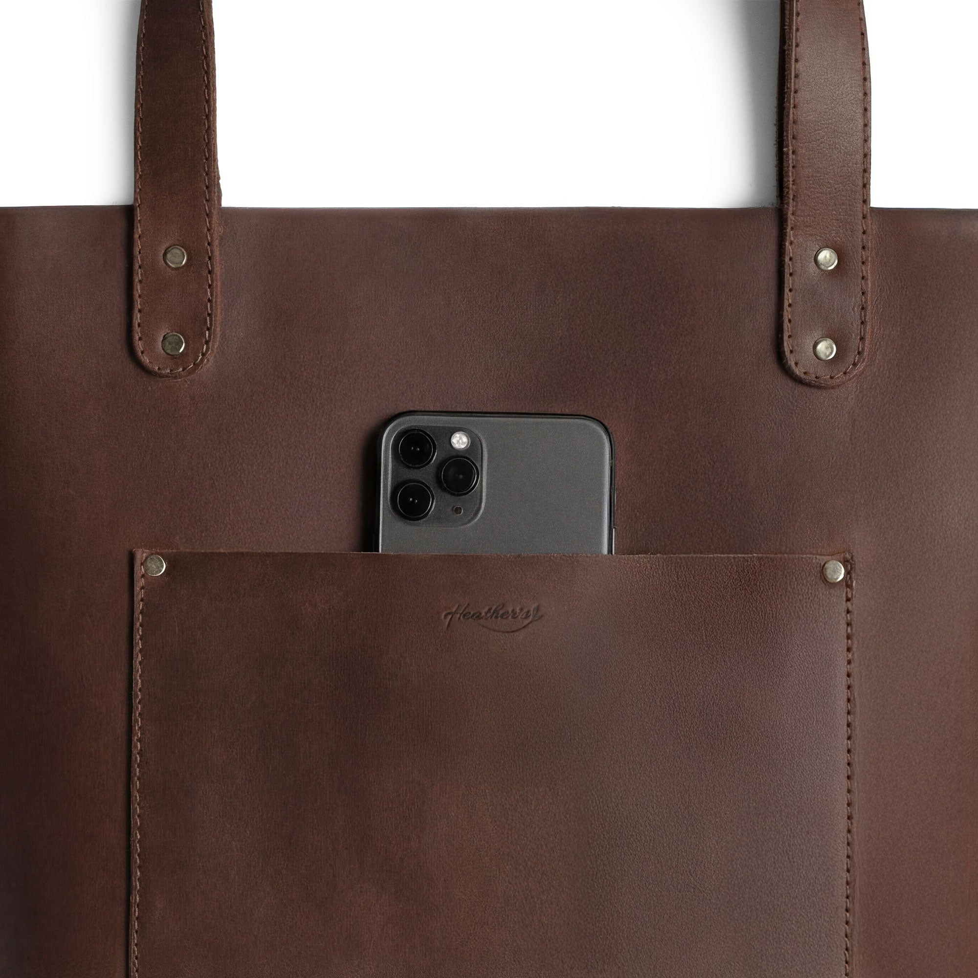 Heather's Minimalist Tote Bag With Pouch open, revealing its spacious interior perfect for essentials. This Classic Tote Bag Shoulder Bag for Women with Pouch is made from full grain leather and exemplifies small batch production, hand cut and hand sewn by artisans.