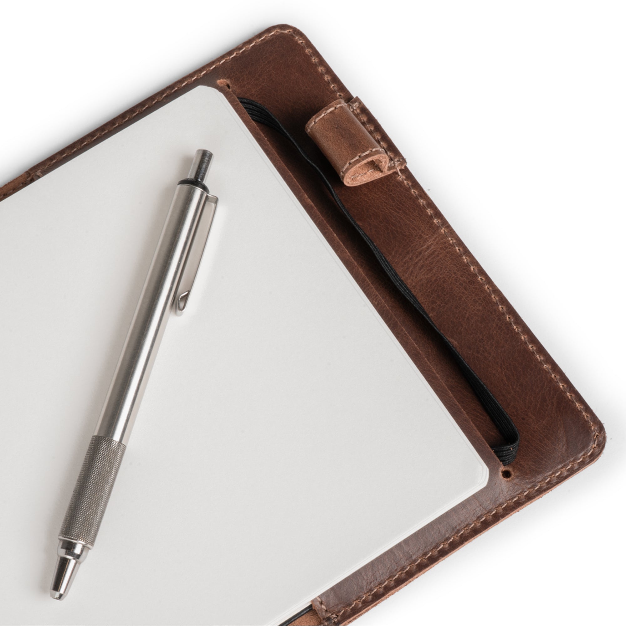 Close-up of the Cover for Leuchtturm1917 Sketchbook Hardcover A5 Medium Size (145 x 210 mm) by Hide & Drink, displaying a pen slot within the elegant Journal Case. Made from Full Grain Leather, this artisan piece reflects the dedication to hand-cut and hand-sewn craftsmanship in small batch production.