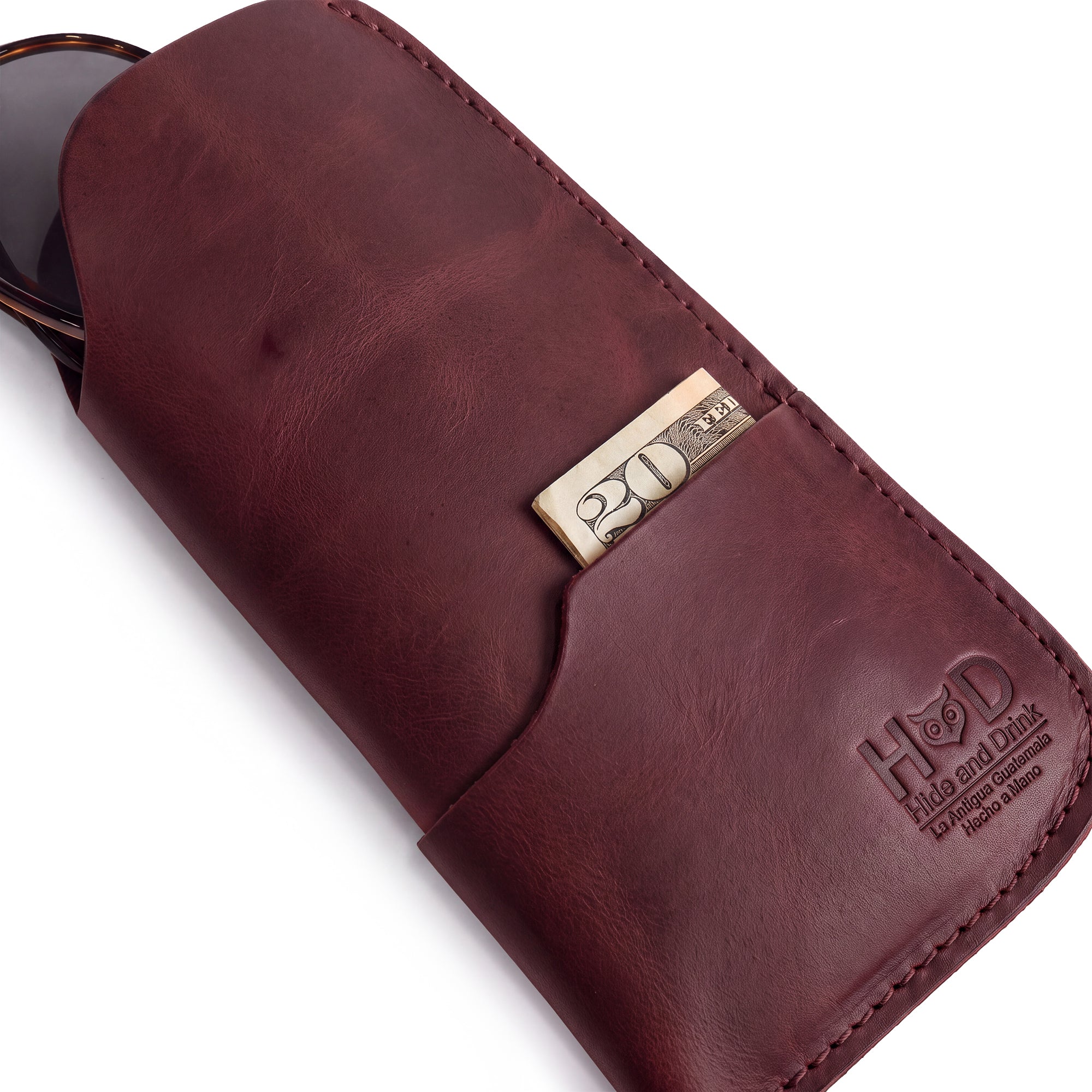 The Hide & Drink Sunglass Case & Wallet presented in a tan finish, confirming its rustic charm. This Rustic Sunglasses Case & Wallet provides excellent protection as a Full Grain Leather glasses protector for travel, inspired by artistry from La Antigua Guatemala & Oaxaca Mexico.