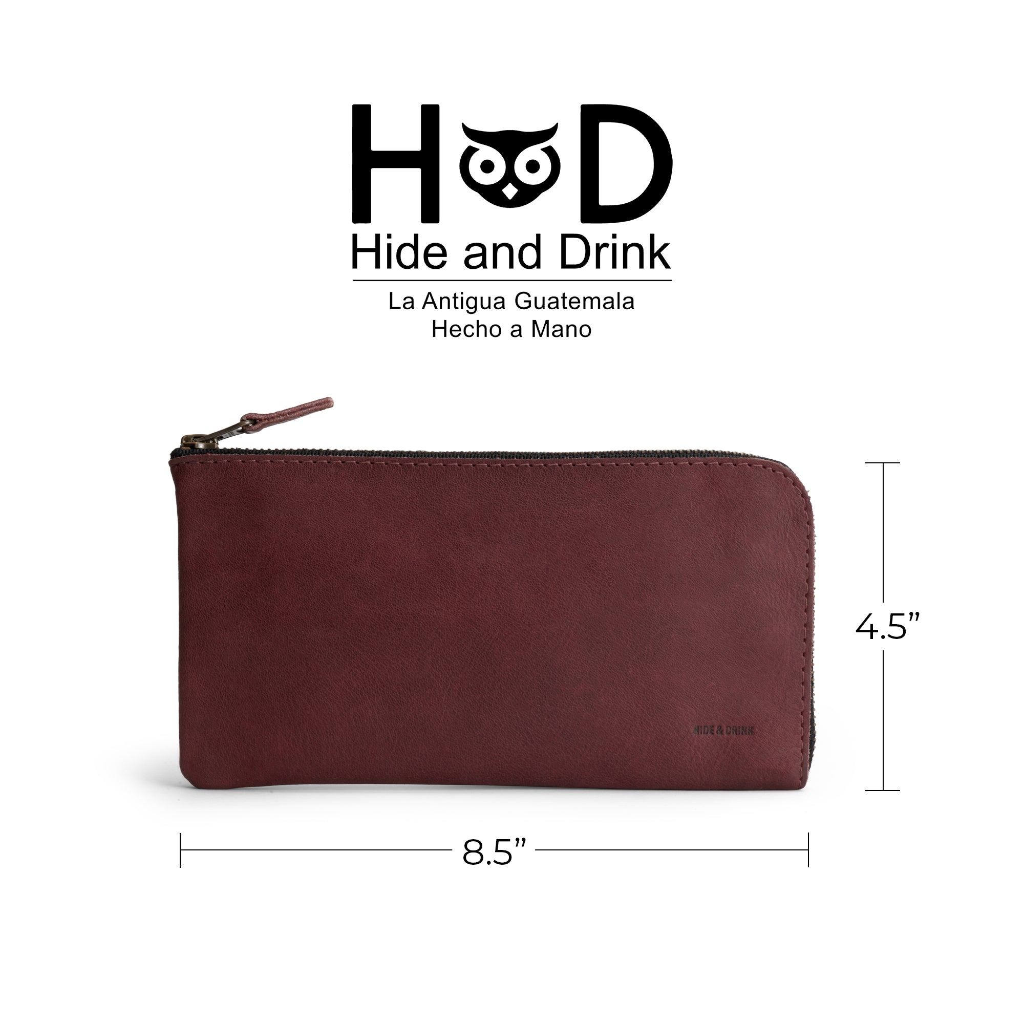 A vibrant Sangria Large Zippered Wallet by Hide & Drink, measuring 8.5 x 4.5 inches. Perfect Long Zippered Wallet for Men and Women, this stylish Card Holder and Card Organizer is made from durable Full Grain Leather. An ideal Bill Holder and travel accessory, handcrafted in La Antigua Guatemala & Oaxaca Mexico, showcasing the essence of small batch production with fire branded artisan details.