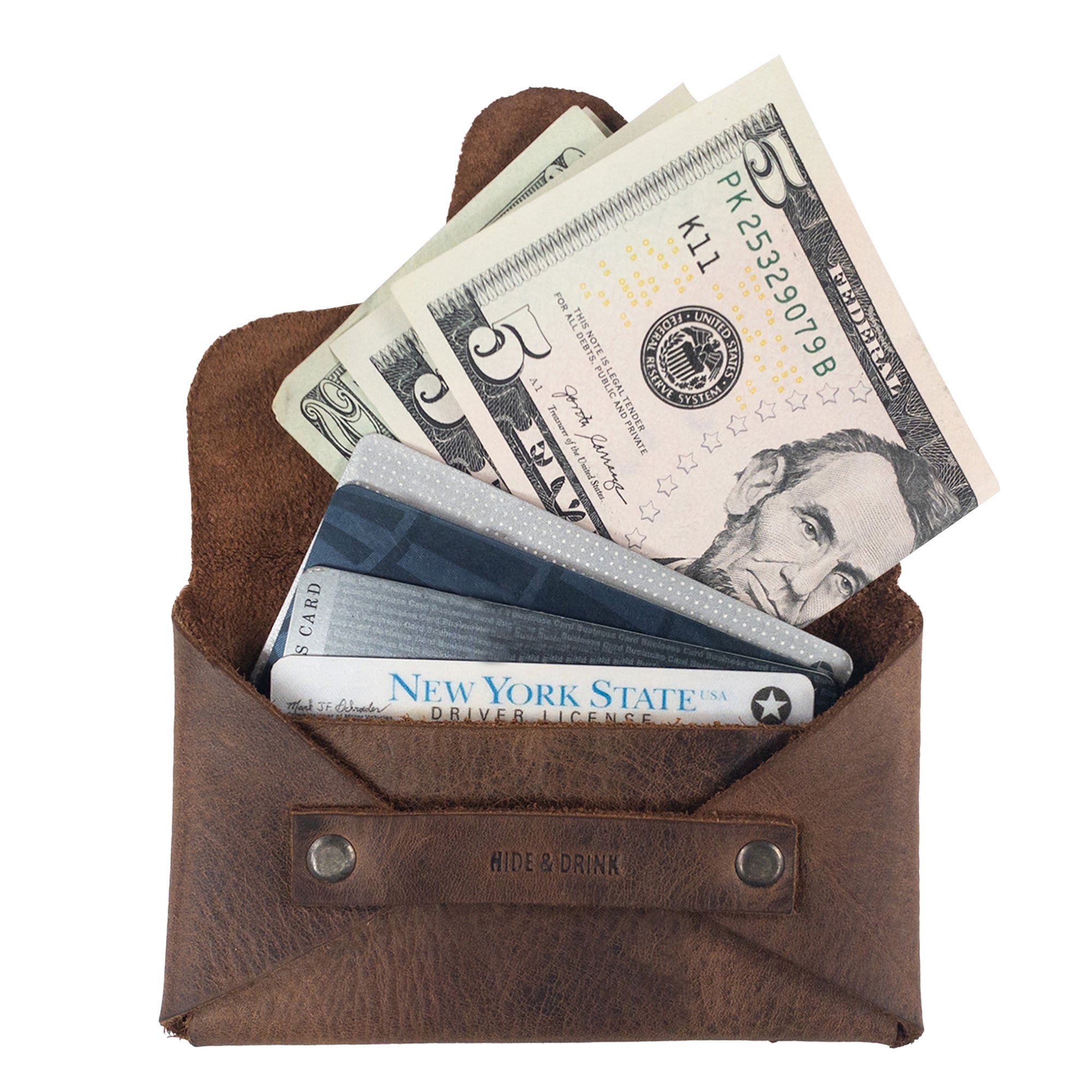 Hide & Drink's Snapless Business Card Holder showcasing bills and cards inside, perfect for men and women. This vintage wallet offers a sturdy pouch for organizing cash, made from premium Full Grain Leather. Ideal as a money organizer, this piece reflects StockyardX's commitment to small batch production, with each wallet hand cut and hand sewn by artisans in La Antigua Guatemala and Oaxaca Mexico.