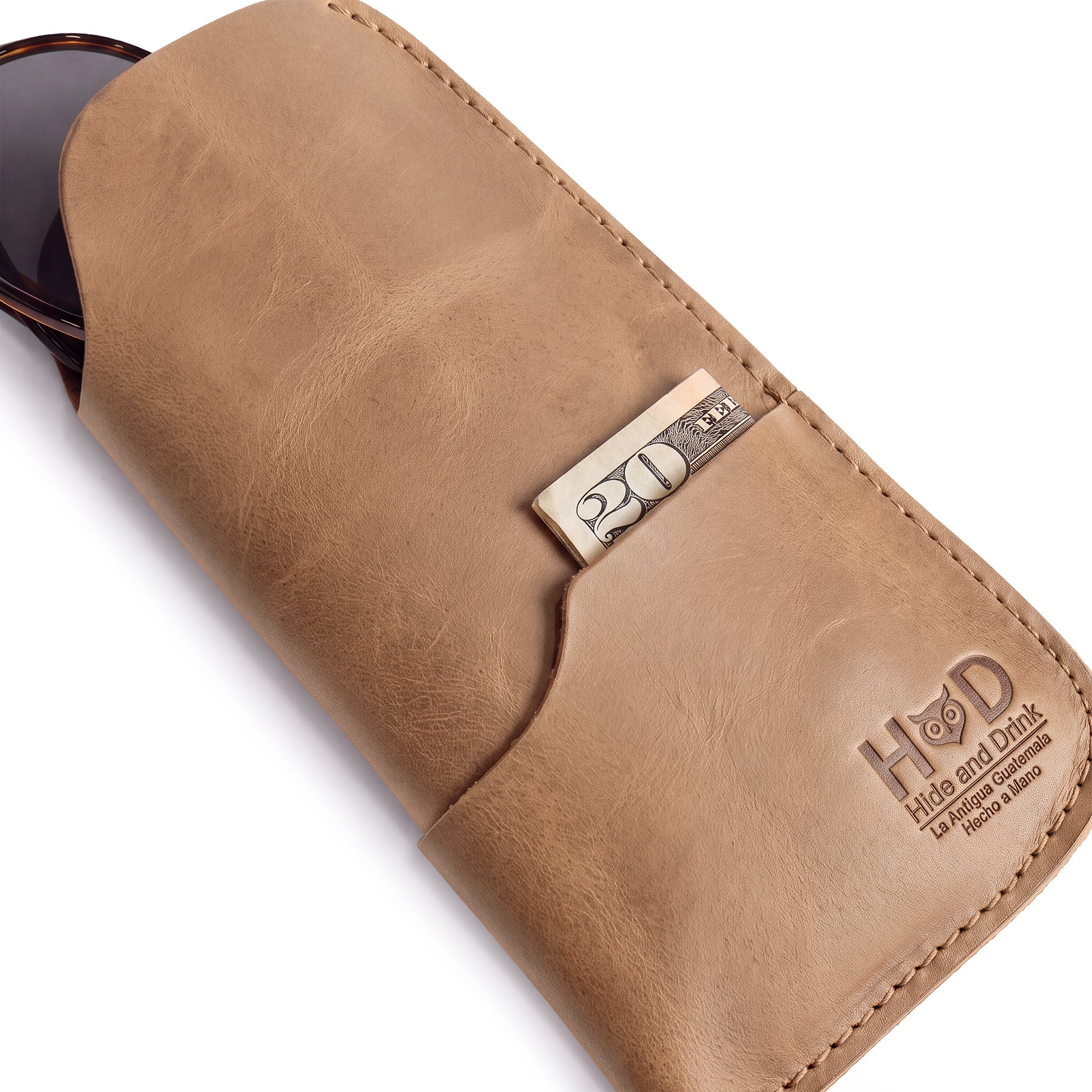 Elevating style with the Hide & Drink Sunglass Case & Wallet in dark brown leather, essential for the discerning traveler. This Rustic Sunglasses Case & Wallet is made from Full Grain Leather, a must-have eyeglasses protector for travel, handcrafted in La Antigua Guatemala & Oaxaca Mexico.