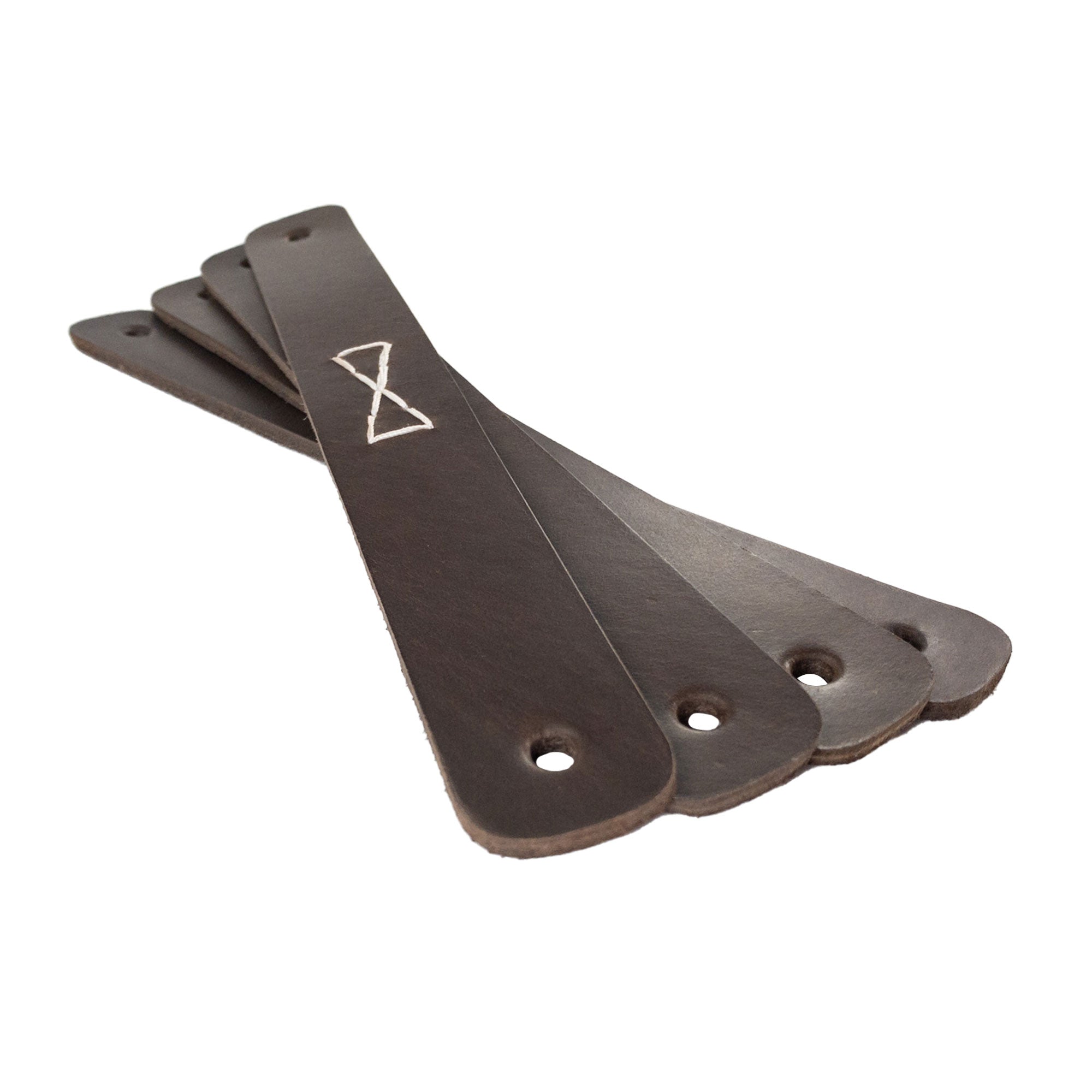 A collection of four Rectangular Drawer Handles with Bowtie Stitching Design, highlighting the exquisite quality of full grain leather. Made by Hide & Drink, this 4 Pack showcases handcrafted beauty and artisan work from La Antigua Guatemala & Oaxaca Mexico.