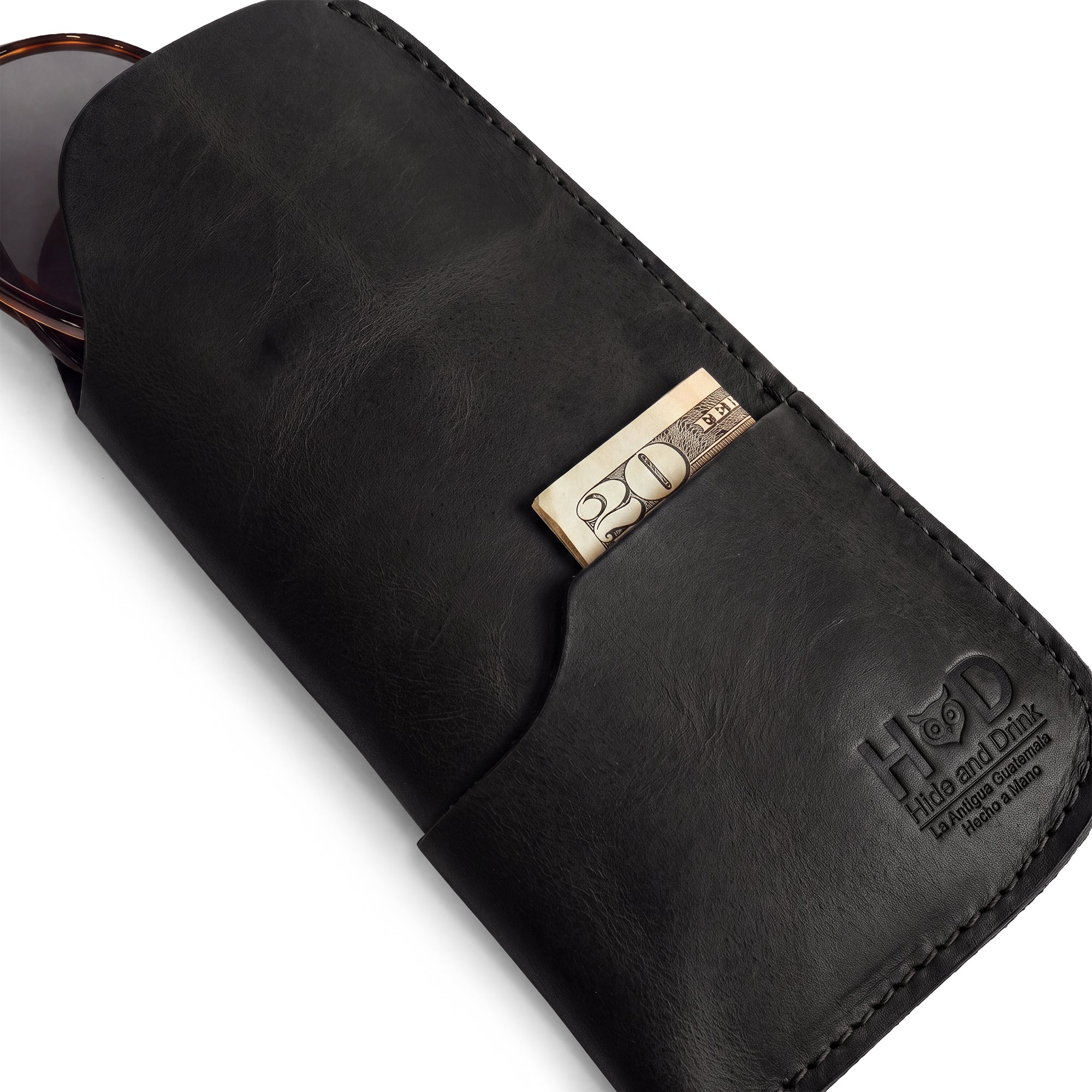 Exquisite view of the Hide & Drink Sunglass Case & Wallet, perfect for summer outings. This Rustic Sunglasses Case & Wallet is made from premium Full Grain Leather, ensuring a stylish eyeglasses sleeve for travel, handcrafted in La Antigua Guatemala & Oaxaca Mexico.