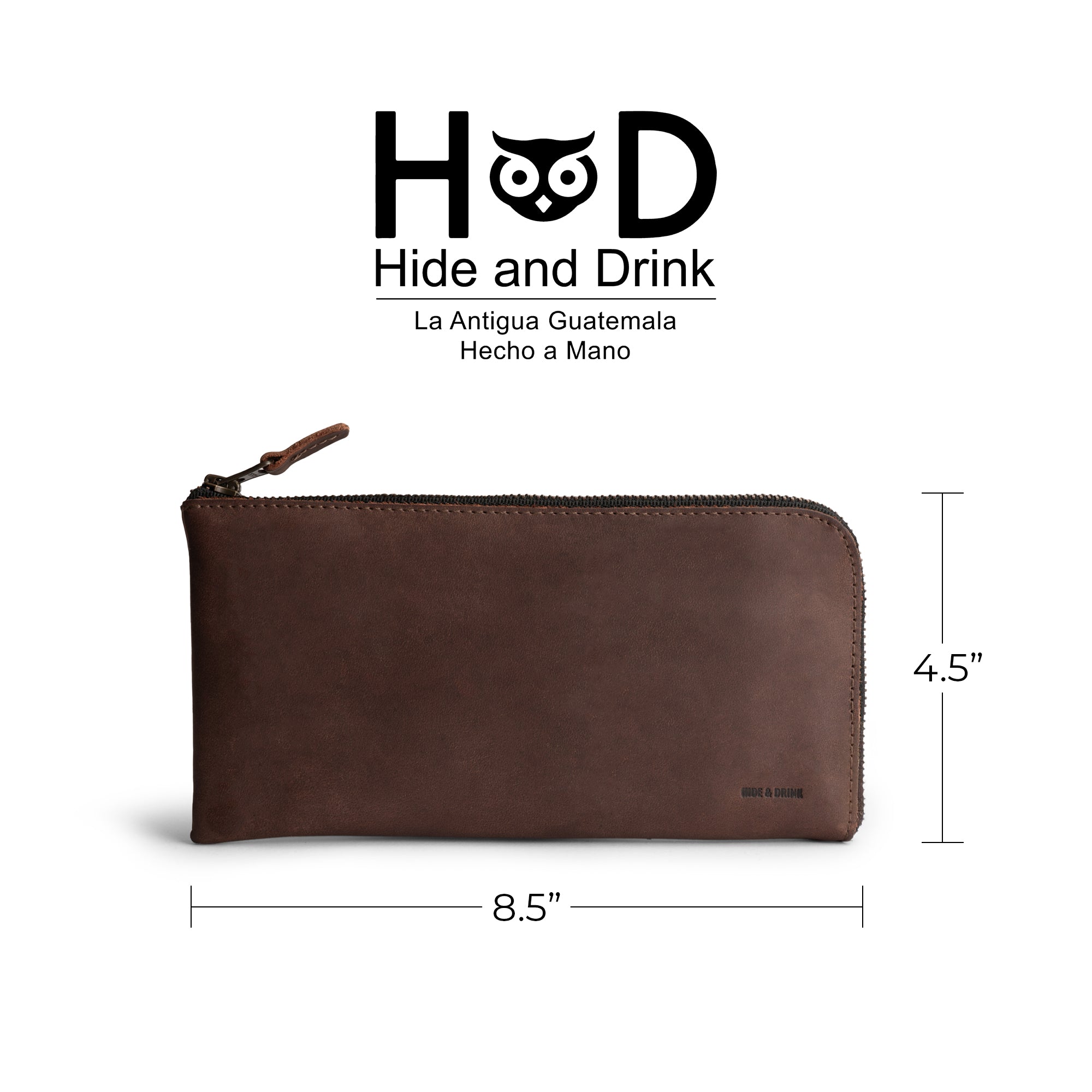 A Bourbon Brown Large Zippered Wallet by Hide & Drink, measuring 8.5 x 4.5 inches. Perfect Long Zippered Wallet for Men and Women, this stylish Card Holder and Card Organizer is made from durable Full Grain Leather. An ideal Bill Holder and travel accessory, handcrafted in La Antigua Guatemala & Oaxaca Mexico, showcasing the essence of small batch production with fire branded artisan details.