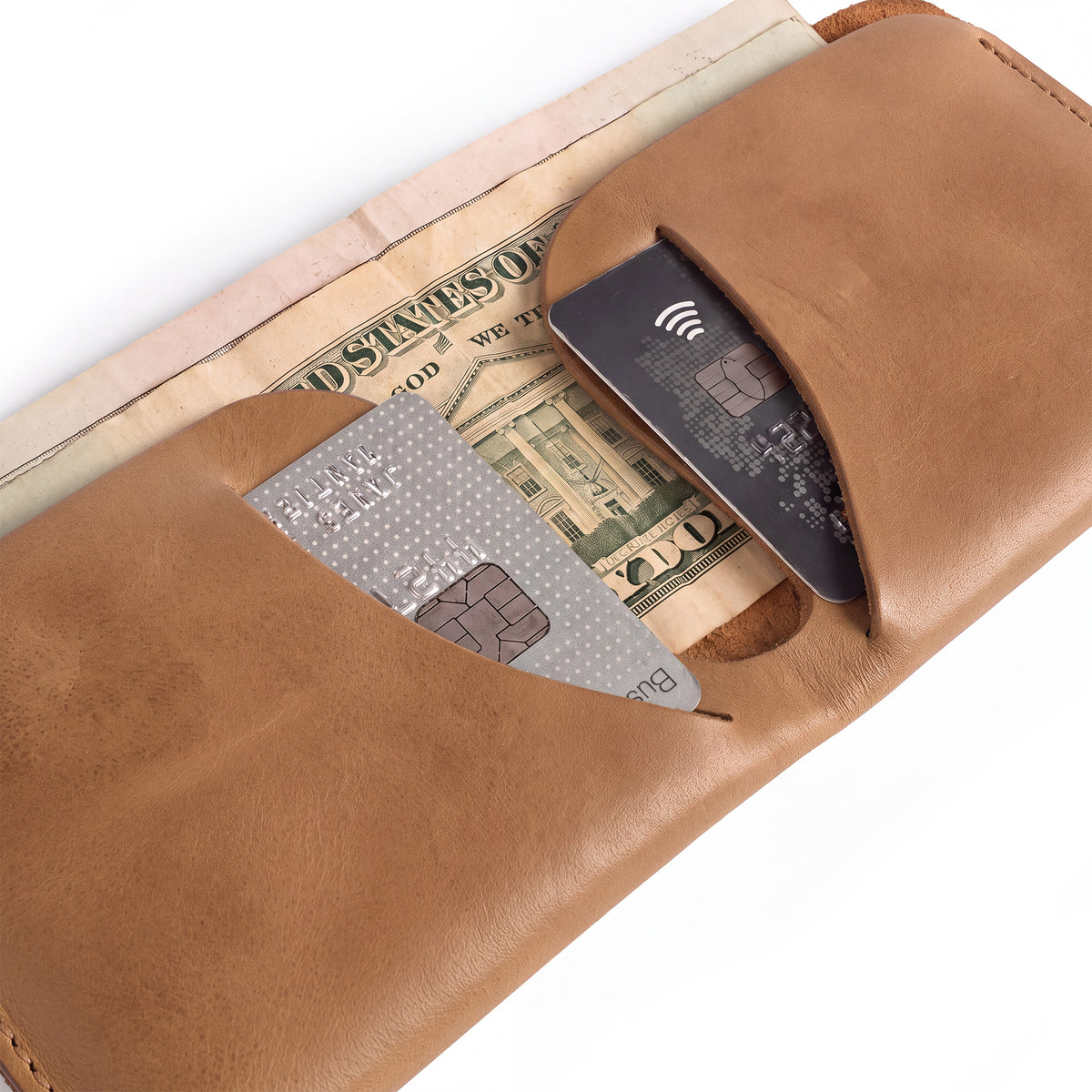 Interior view of the Hide & Drink Minimal Wallet showing card slots and cash compartments, made from durable Full Grain Leather. This Classic Slimfold Wallet serves as an effective Card Organizer Holder and Travel Accessory crafted through dedicated Small Batch Production by artisans in La Antigua Guatemala & Oaxaca Mexico.