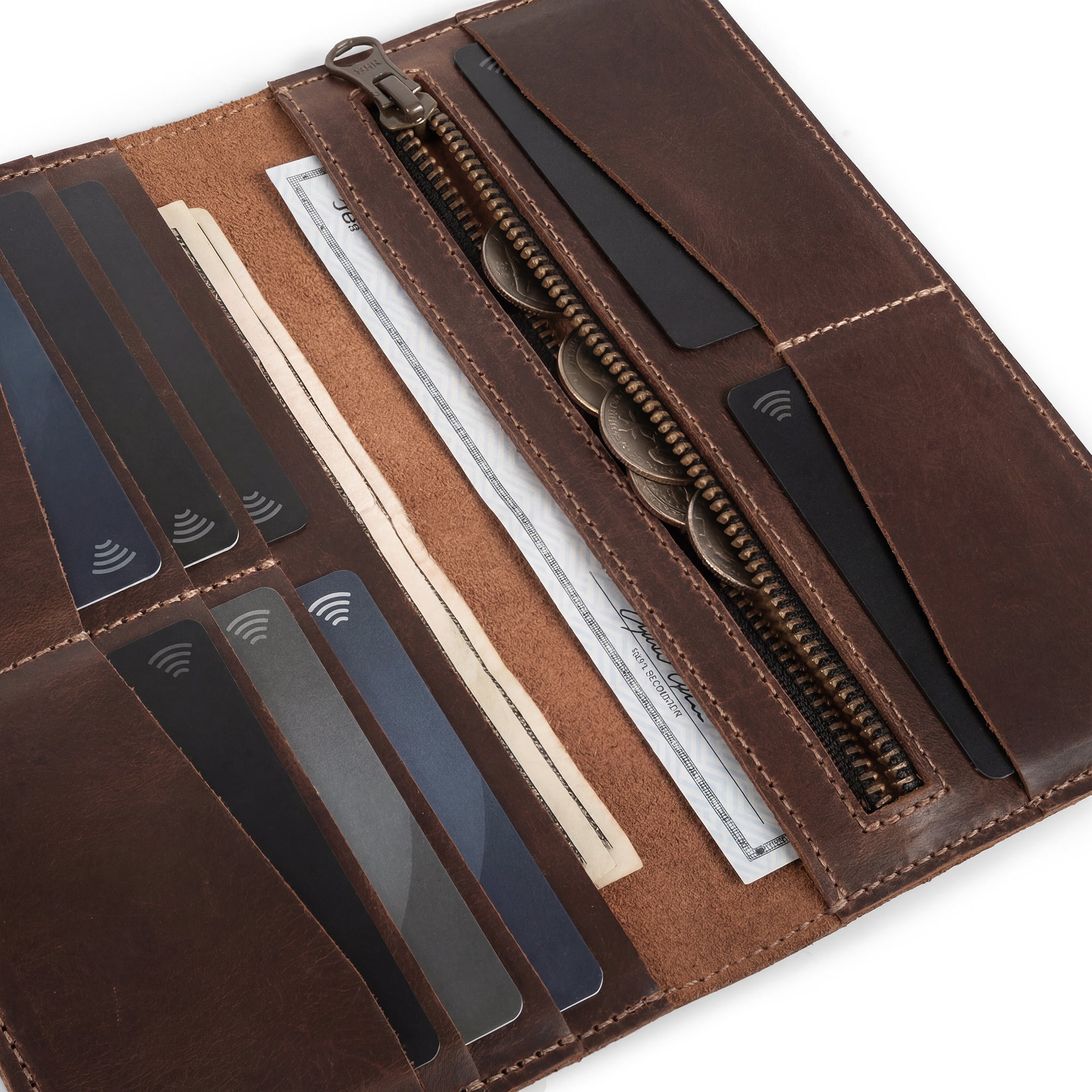 Close-up of the interior layout of The Lamar Long Bifold Wallet by Austin Genuine, featuring a coin pocket and card slots in beautifully crafted Full Grain Leather. This piece reflects Austin’s bold passion, vibrant popular culture, and unmistakable Texas spirit, with Small Batch Production, Hand Cut, Hand Sewn, Fire Branded Artisan craftsmanship; handmade in La Antigua Guatemala & Oaxaca Mexico.