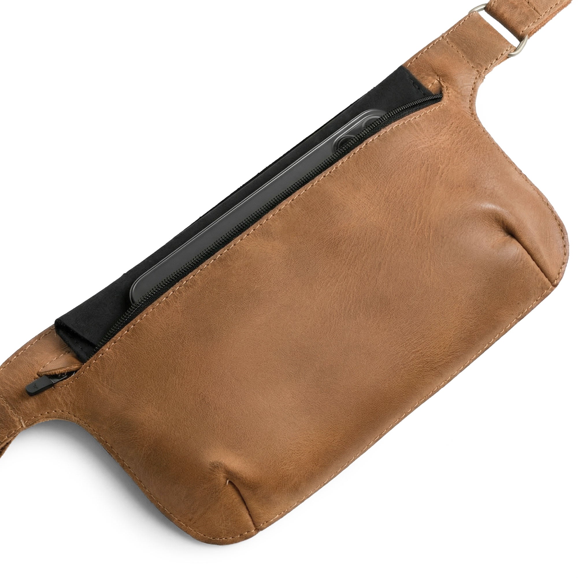 Slim Fanny Pack by Hide & Drink opened to display a compact interior space, designed for organizing small essentials. This artisan piece made from full grain leather represents small batch craftsmanship in Oaxaca Mexico.