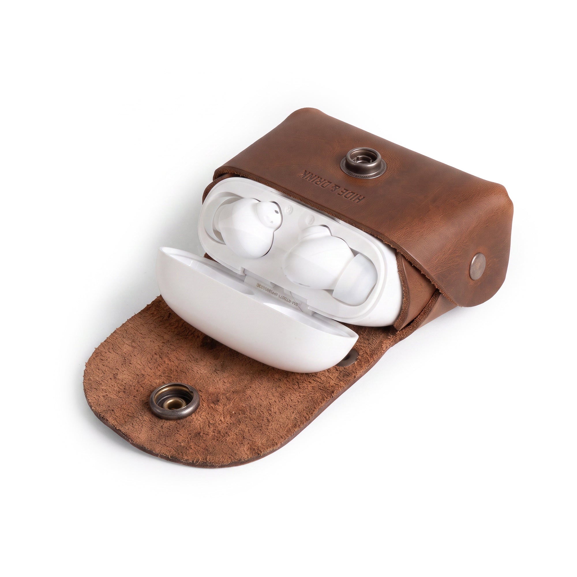 Tiny Handbag Keychain featuring a rustic design with key ring holder, crafted from full grain leather by Hide & Drink. This artisan-made Tiny Handbag with Key Ring Holder, Full Grain Leather, showcases small batch production, hand cut, hand sewn, and fire branded techniques, handmade in La Antigua Guatemala & Oaxaca Mexico.