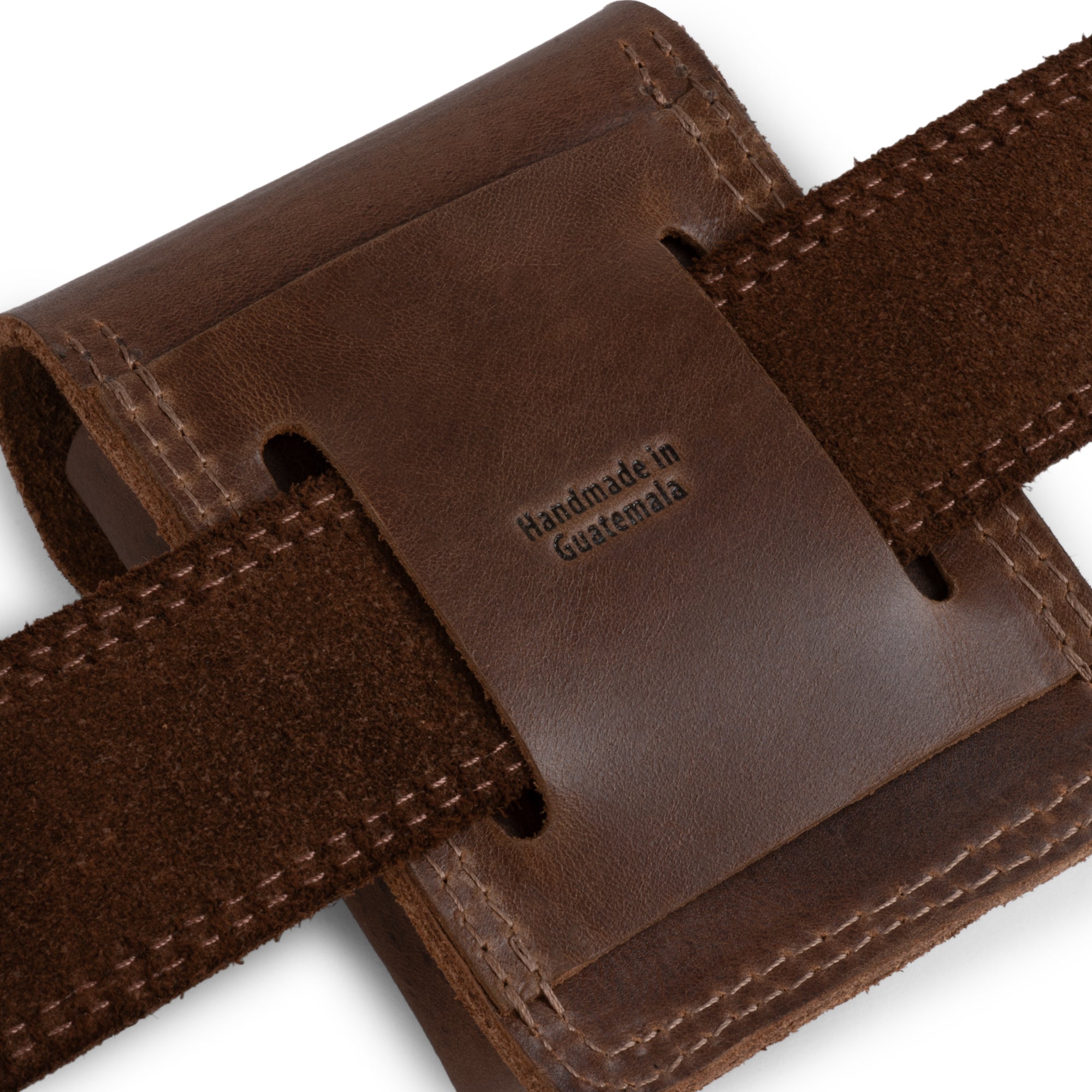 Valhalla Gear's The Herne, Bushcraft Belt Pouch displayed with its strap, highlighting its functionality as a Tool Gear Accessory. This Compact Outdoor Case and Multitool Sheath are ideal for everyday carry, showcasing Hand Cut, Hand Sewn details, all made in La Antigua Guatemala & Oaxaca Mexico.