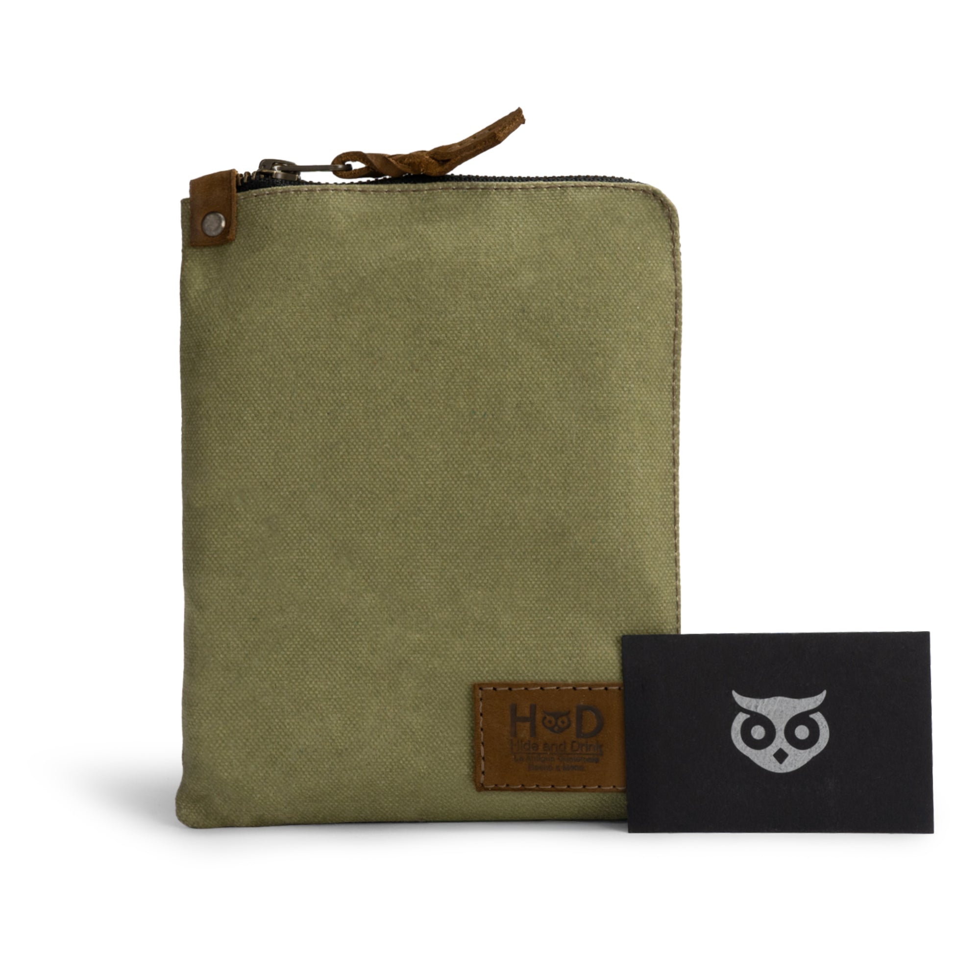 Scribbler Case in green by Hide & Drink, showcasing Waxed Canvas material. Perfect for notebooks, highlighting small batch production, artisan craftsmanship, and fire-branded design. Handmade in La Antigua Guatemala & Oaxaca Mexico.