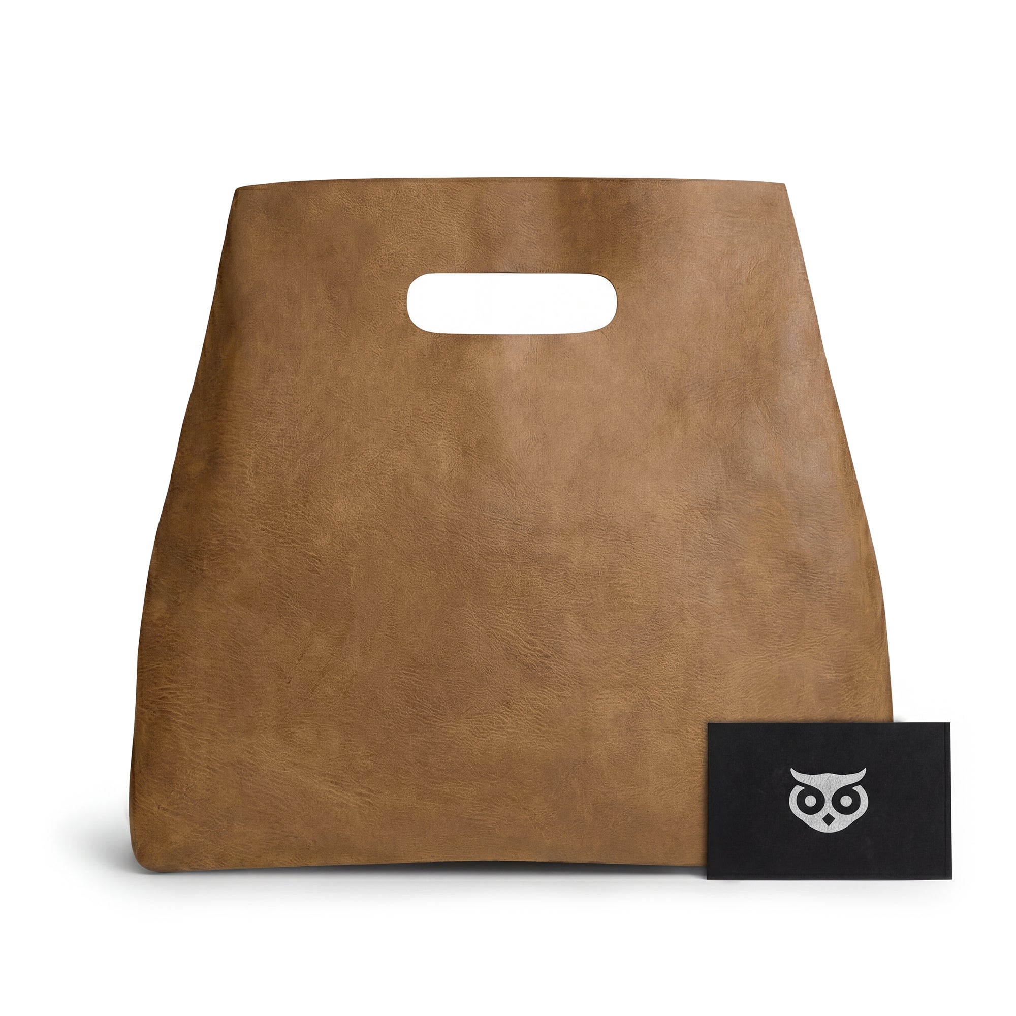 The Minimalist Boho Handbag by Hide & Drink displayed with a tag for authenticity. This Minimalist Handbag for Women, suitable as a Rustic Purse, is made from Full Grain Leather that reflects quality craftsmanship from artisans in La Antigua Guatemala & Oaxaca Mexico.