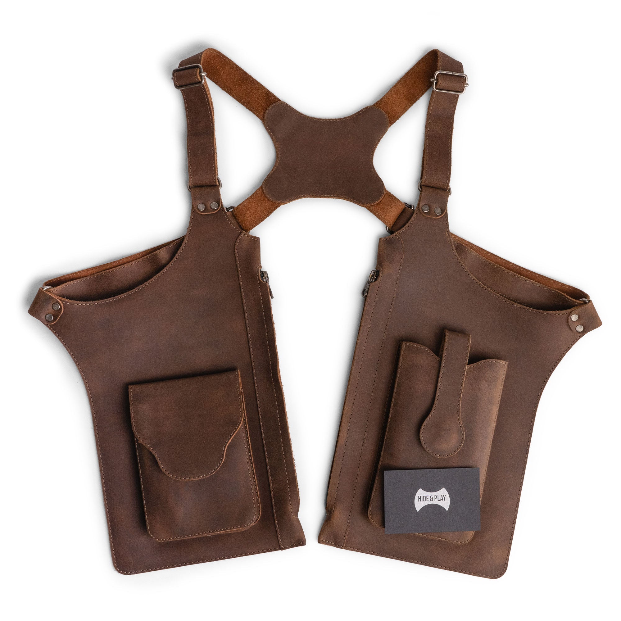 Hide & Play's Zippered Shoulder Holster presented in a polished setting, emphasizing its vintage aesthetic and practical design. An adjustable harness with zippered bags makes it ideal for costume parties, crafted from high-quality full grain leather, embodying artisan workmanship and small batch production in La Antigua Guatemala & Oaxaca Mexico.