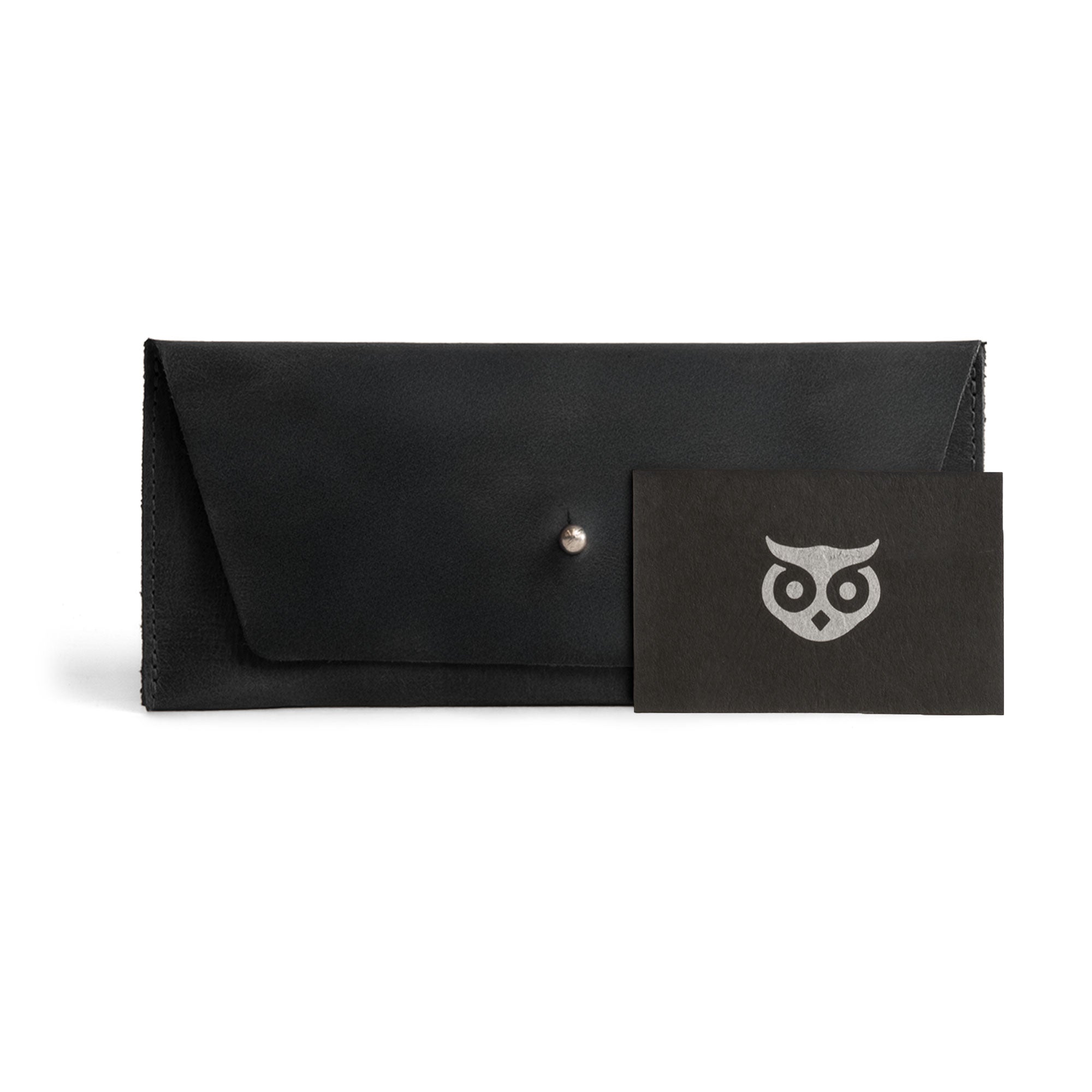 The Long Utility Pouch by Hide & Drink presented with a gift card, highlighting its sophisticated design that makes a great gift. Ideal for keeping cash, coins, and cards organized.