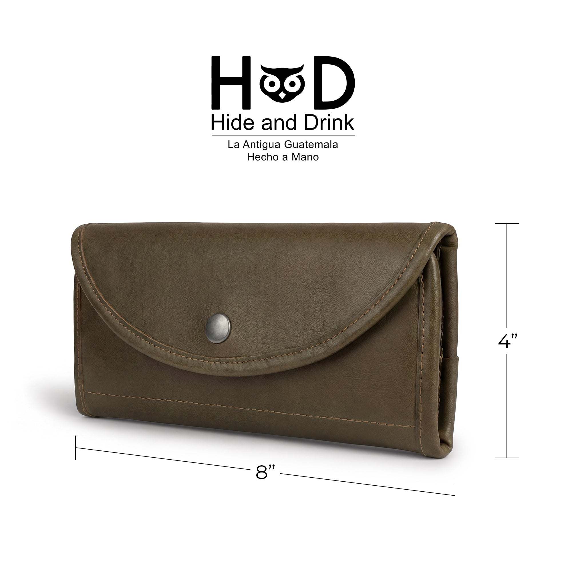 by Hide & Drink, showcasing its neat design. This Snap Clutch Wallet for Women is a chic money holder and card organizer with a zippered pouch, crafted from quality full grain leather and artisan made in La Antigua Guatemala.