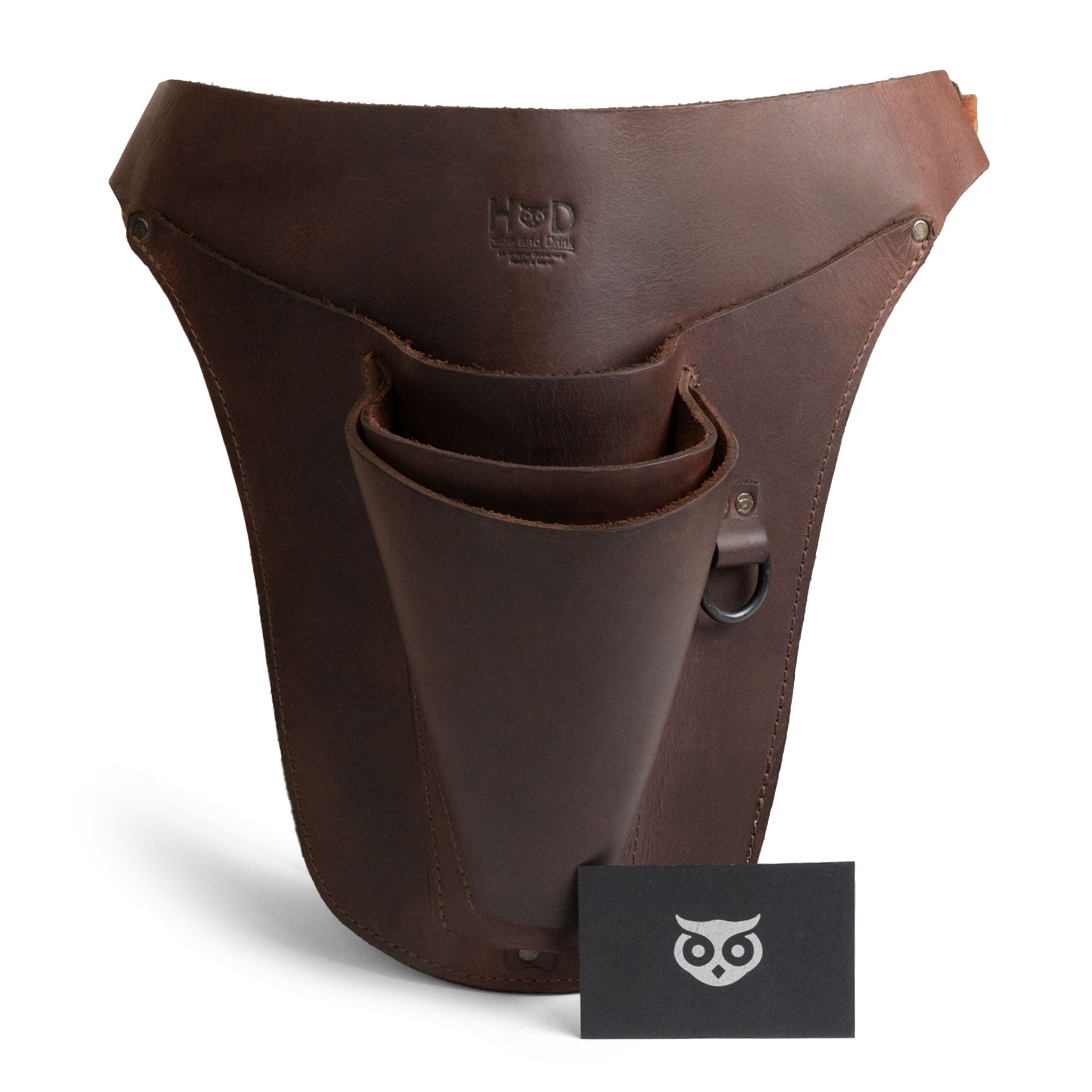 Hide & Drink Florist Tool Belt with a business card, showcasing its premium Full Grain Leather construction. This stylish and practical Florist Tool Belt for Men & Women is perfectly designed for gardeners, electricians, and craftsmen. Hand cut, hand sewn, and fire branded, made in La Antigua Guatemala & Oaxaca Mexico.