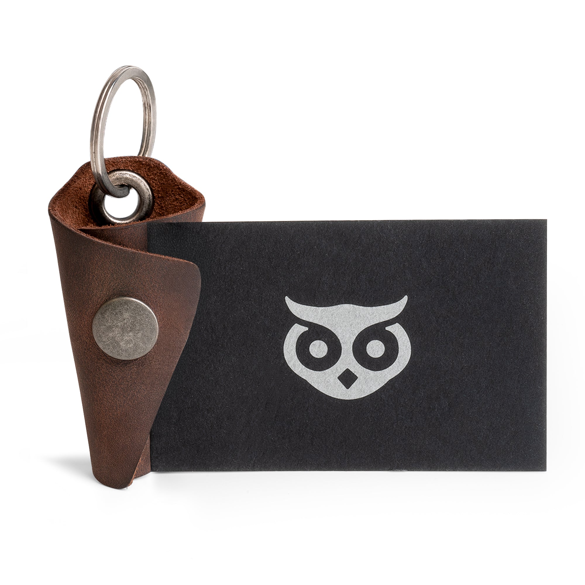 Stylish Wrap Keychain by Hide & Drink, perfect for organizing keys with its secure organizer snap closure. This full grain leather key ring cover also serves as a silencer sleeve key holder for men. Each piece is a testament to artisan craftsmanship, handmade in La Antigua Guatemala, utilizing hand cut and hand sewn methods in a small batch production.