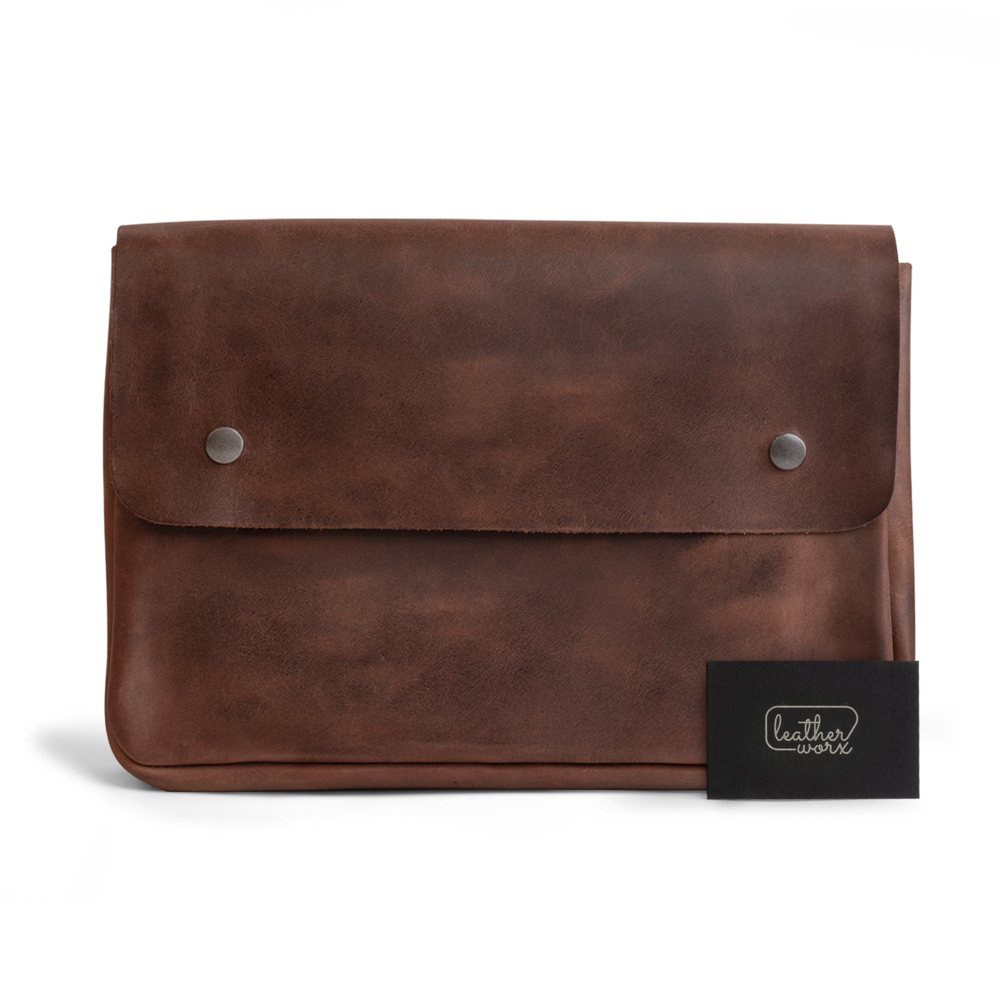 Leather Worx Folder Document Holder presents a refined look, crafted from premium full grain leather. This vintage folder document holder serves as a stylish file case and document portfolio, suited for office and work essentials. Made in La Antigua Guatemala, it showcases artisan craftsmanship, emphasizing small batch production with hand cut and hand sewn techniques, along with fire branded quality.