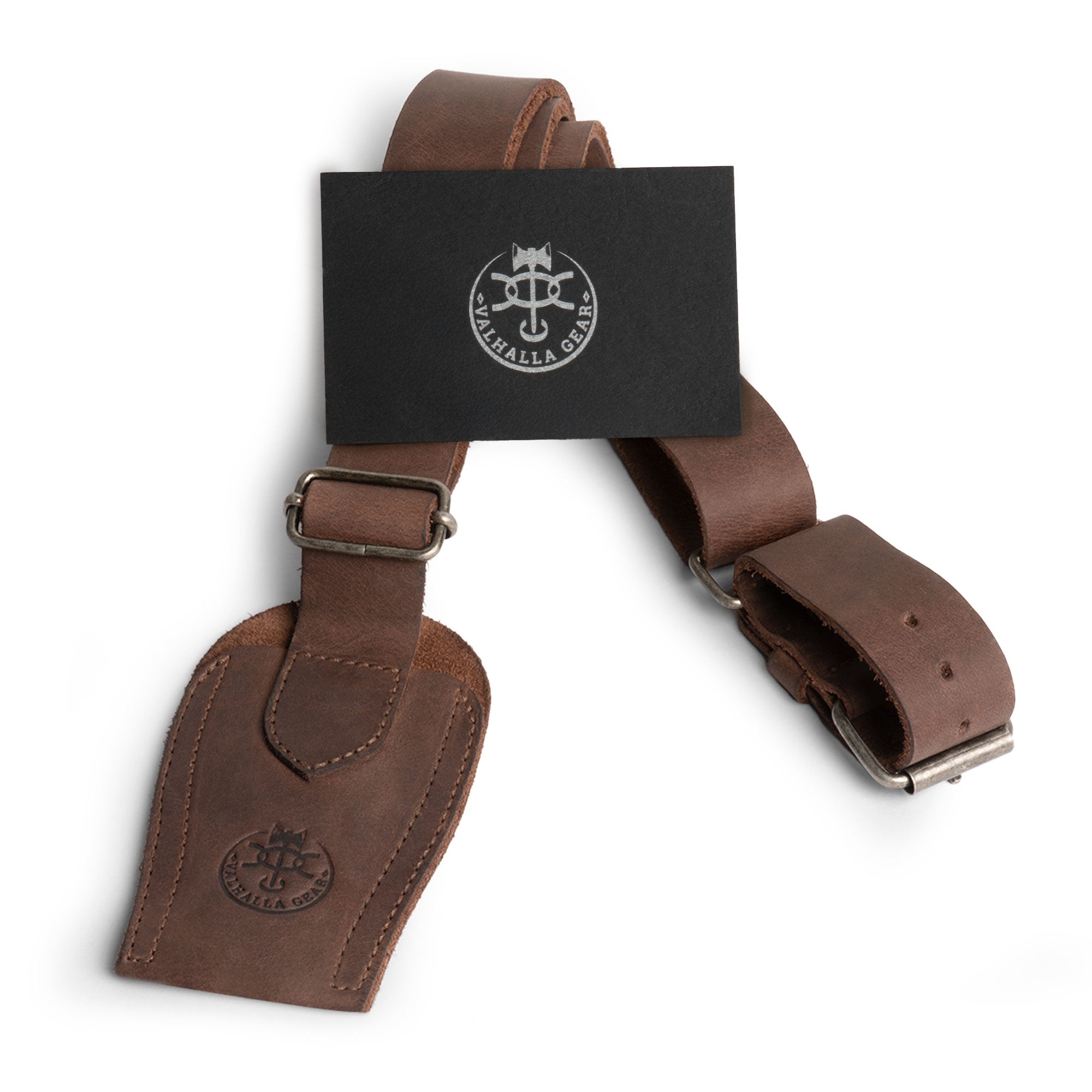 The Archery Bow Sling from Valhalla Gear featuring a stylish presentation, emphasizing its handmade quality and comfortable design for ease of use. Perfect for any archery adventure. Archery Bow Shoulder Strap, Sling, Bow Carrier, Hunting & Practice, Full Grain Leather, StockyardX, Small Batch Production, Hand Cut, Hand Sewn, Fire Branded, Artisan, Handmade in La Antigua Guatemala & Oaxaca Mexico.