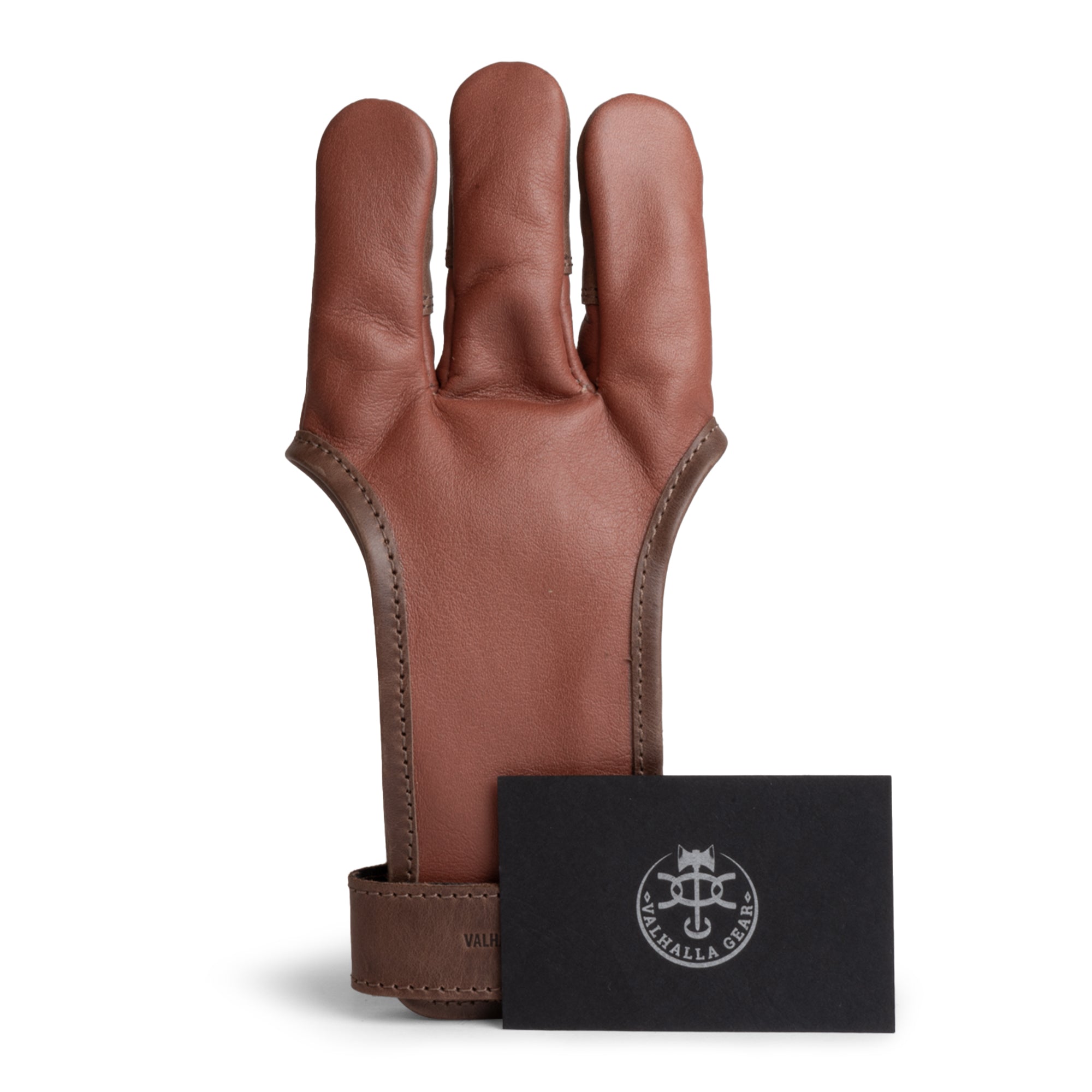 The Valhalla Gear 3-Finger Archery Glove displayed with a stylish brand card. This protective accessory made from premium full grain leather serves as an essential finger tab for archers in various shooting activities. Artisan-made in La Antigua Guatemala & Oaxaca Mexico, it's perfect for both men, women, and youth.