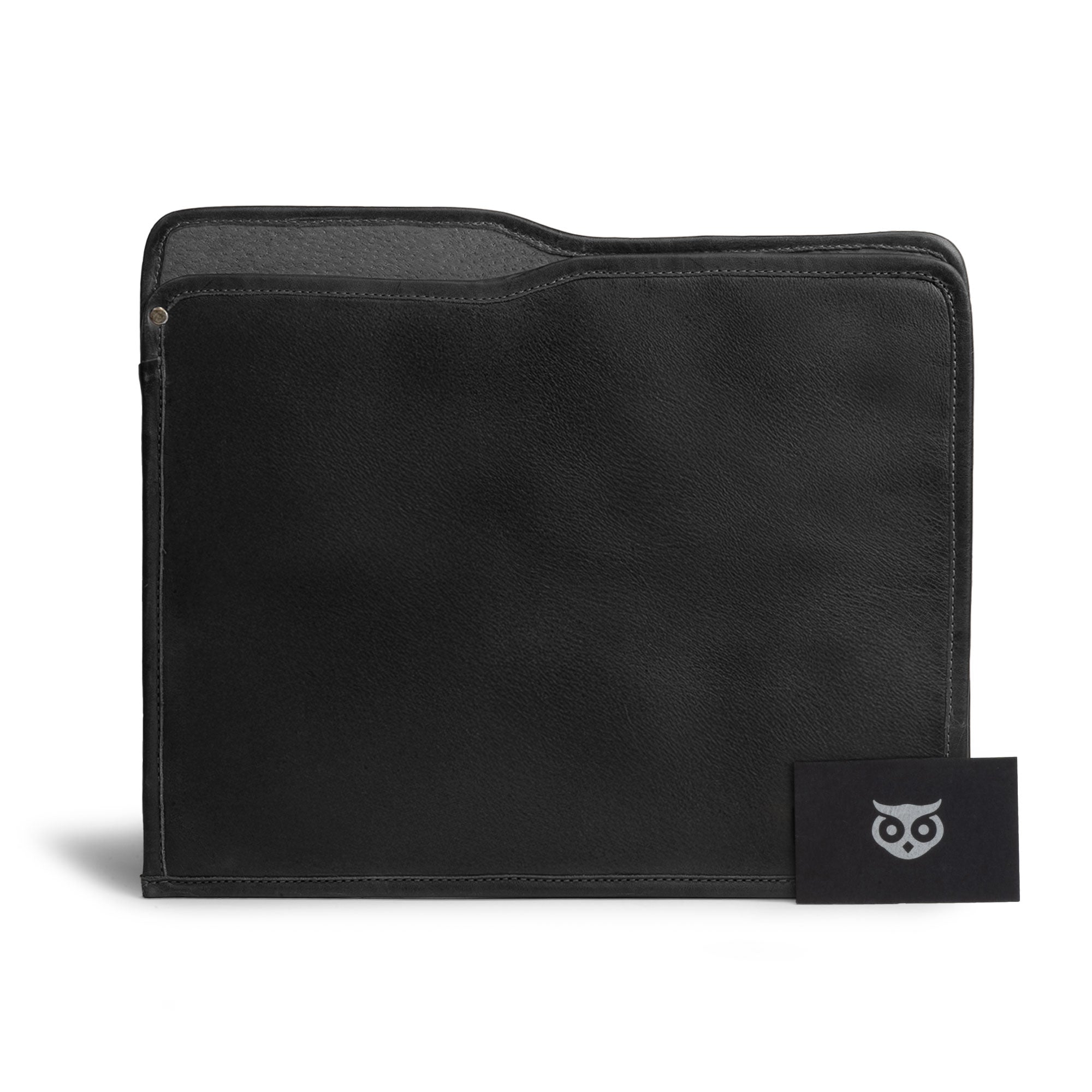 A stylish Manila Folder by Hide & Drink shown with documents, exemplifying its function as a Document Holder. This Full Grain Leather accessory highlights dedicated Small Batch Production and artisan craftsmanship from La Antigua Guatemala and Oaxaca Mexico.