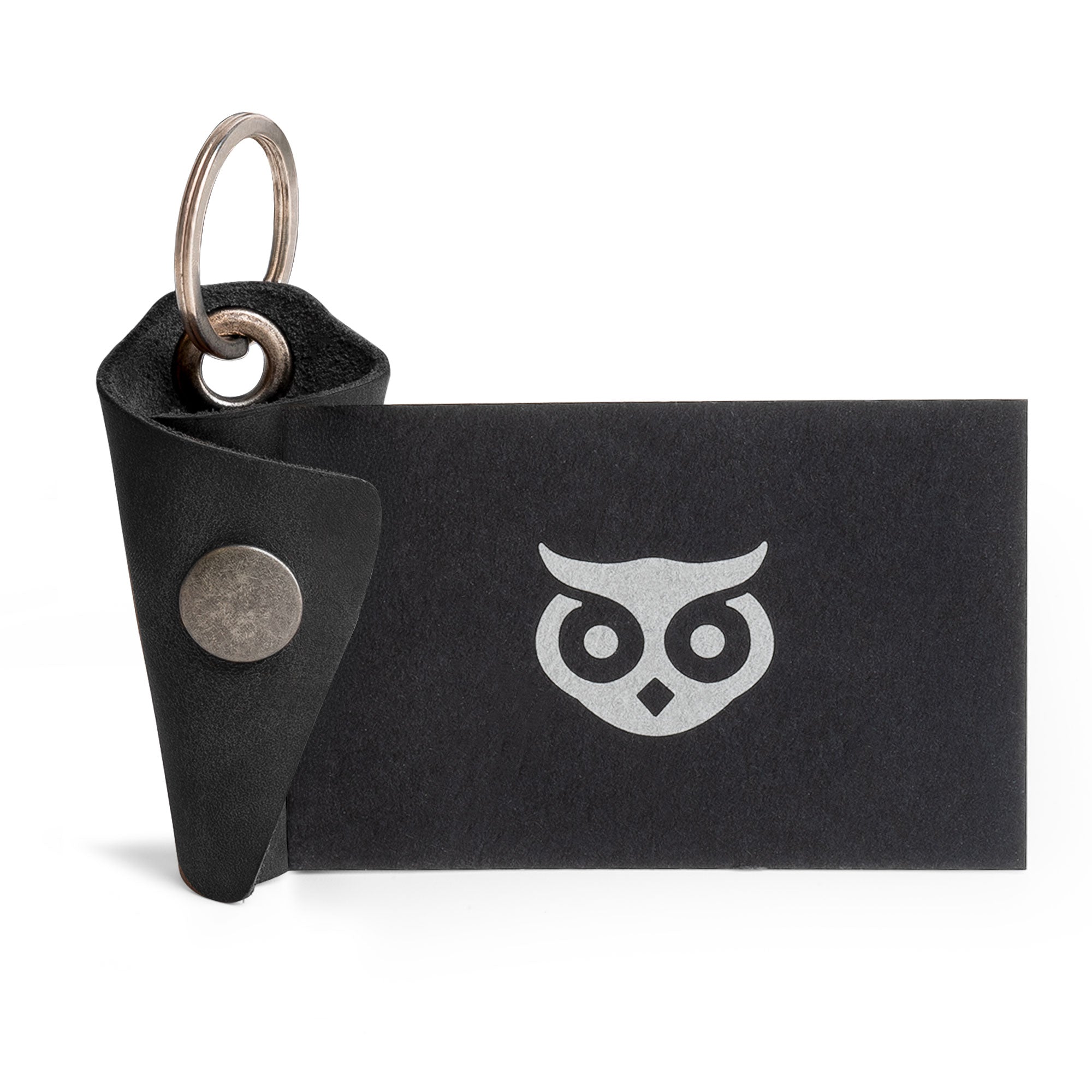 Unique Wrap Keychain from Hide & Drink, crafted with a stylish design in full grain leather. This functional key ring cover features an organizer snap closure and serves as a silencer sleeve key holder for men. Each piece is artisan crafted in La Antigua Guatemala, showcasing the quality of small batch production through its hand cut and hand sewn attributes.