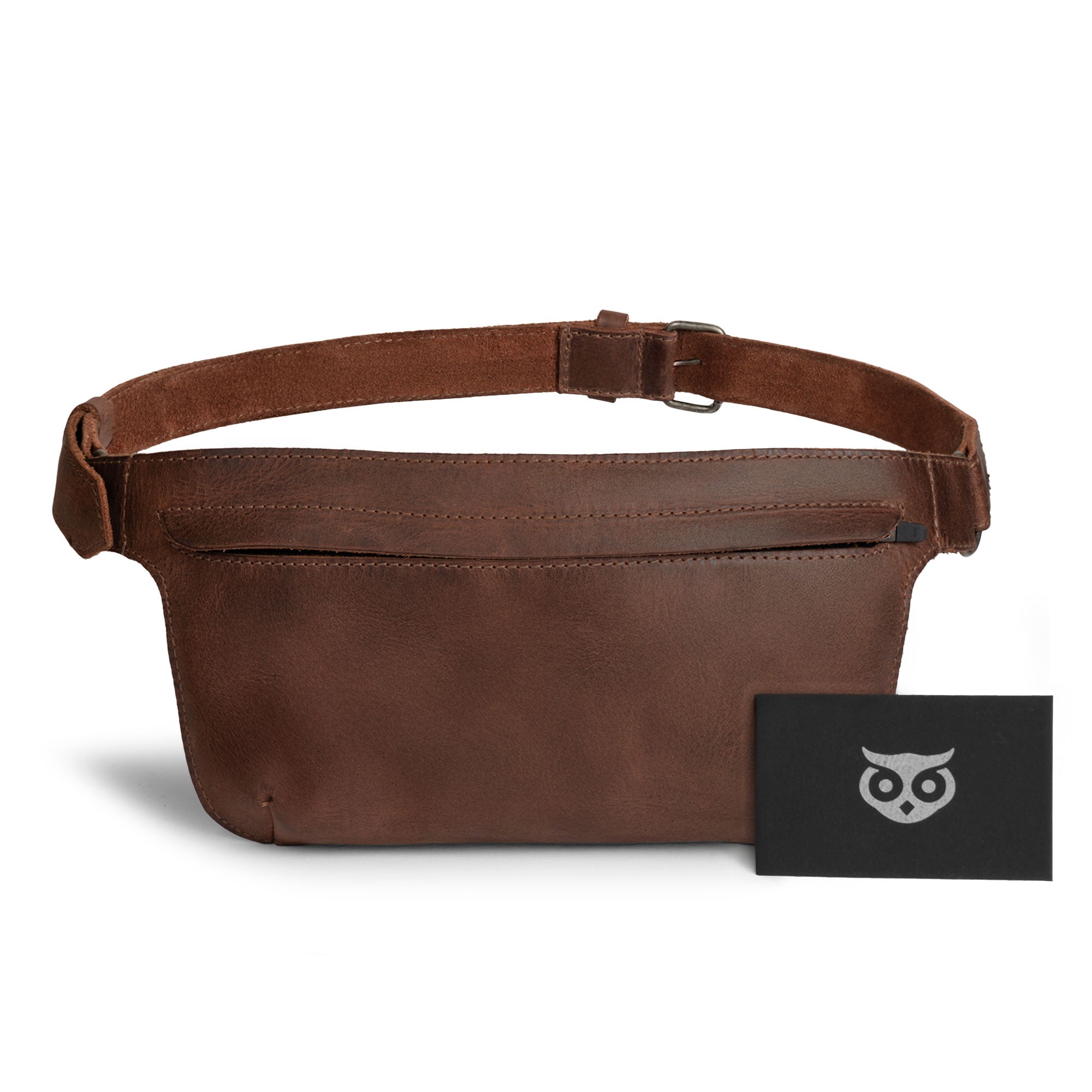 Slim Fanny Pack by Hide & Drink featuring a closed zipper pocket and a grooved texture, showcasing its versatility as a rectangular fanny pack. This full grain leather piece is an artisan masterpiece, handmade in Oaxaca Mexico.