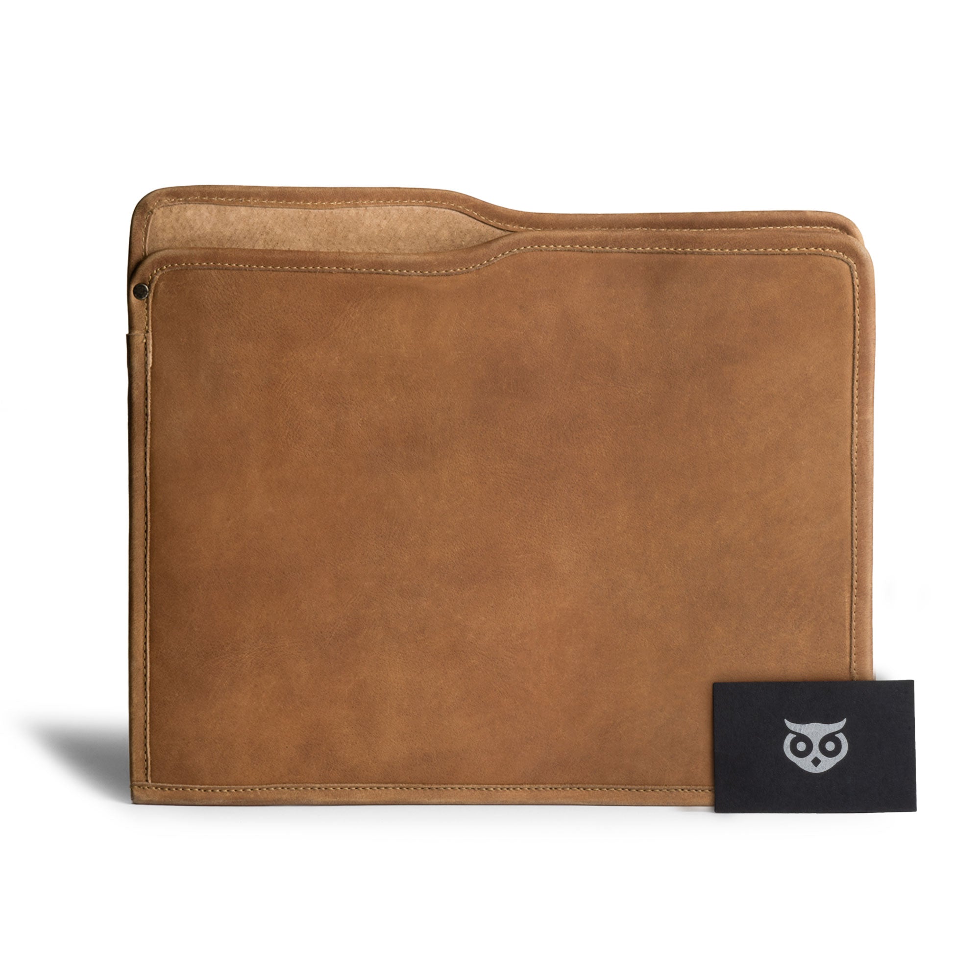 The tan Manila Folder by Hide & Drink displayed with a card, showcasing its versatility as a Document Holder. Made from Full Grain Leather, this item is a prime example of Small Batch Production and artisan craftsmanship from La Antigua Guatemala and Oaxaca Mexico.