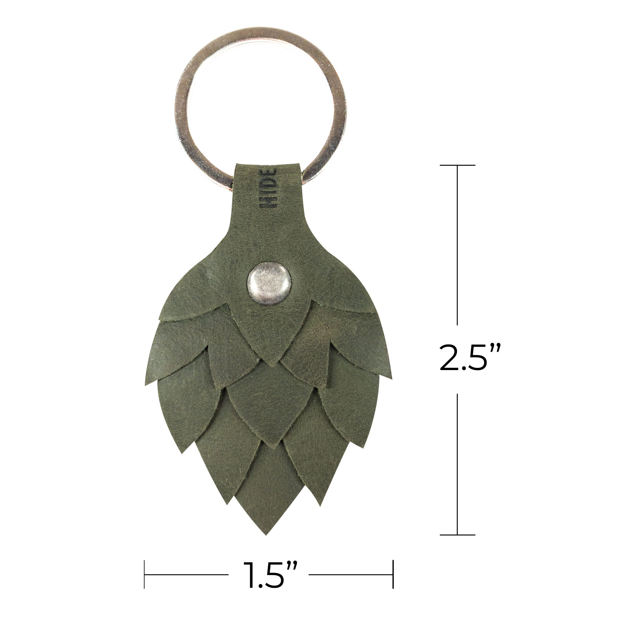 The dimensions of the Hop Flower Keychain by Hide & Drink are highlighted, measuring 1.5 inches wide and 2.5 inches tall, ideal for easy carrying. Made from Full Grain Leather, this keychain is part of StockyardX’s artisan collection, emphasizing hand cut, hand sewn craftsmanship and fire branding, produced in La Antigua Guatemala & Oaxaca Mexico.