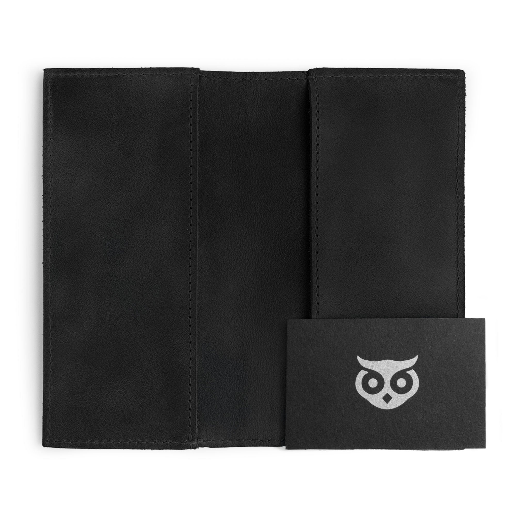 Inside view of the Checkbook Leather Cover by Hide & Drink in black, serving as a minimalist organizer for standard checkbooks. Crafted from full grain leather, this handmade item demonstrates the skills of artisans in La Antigua Guatemala and Oaxaca Mexico with a focus on small batch production.