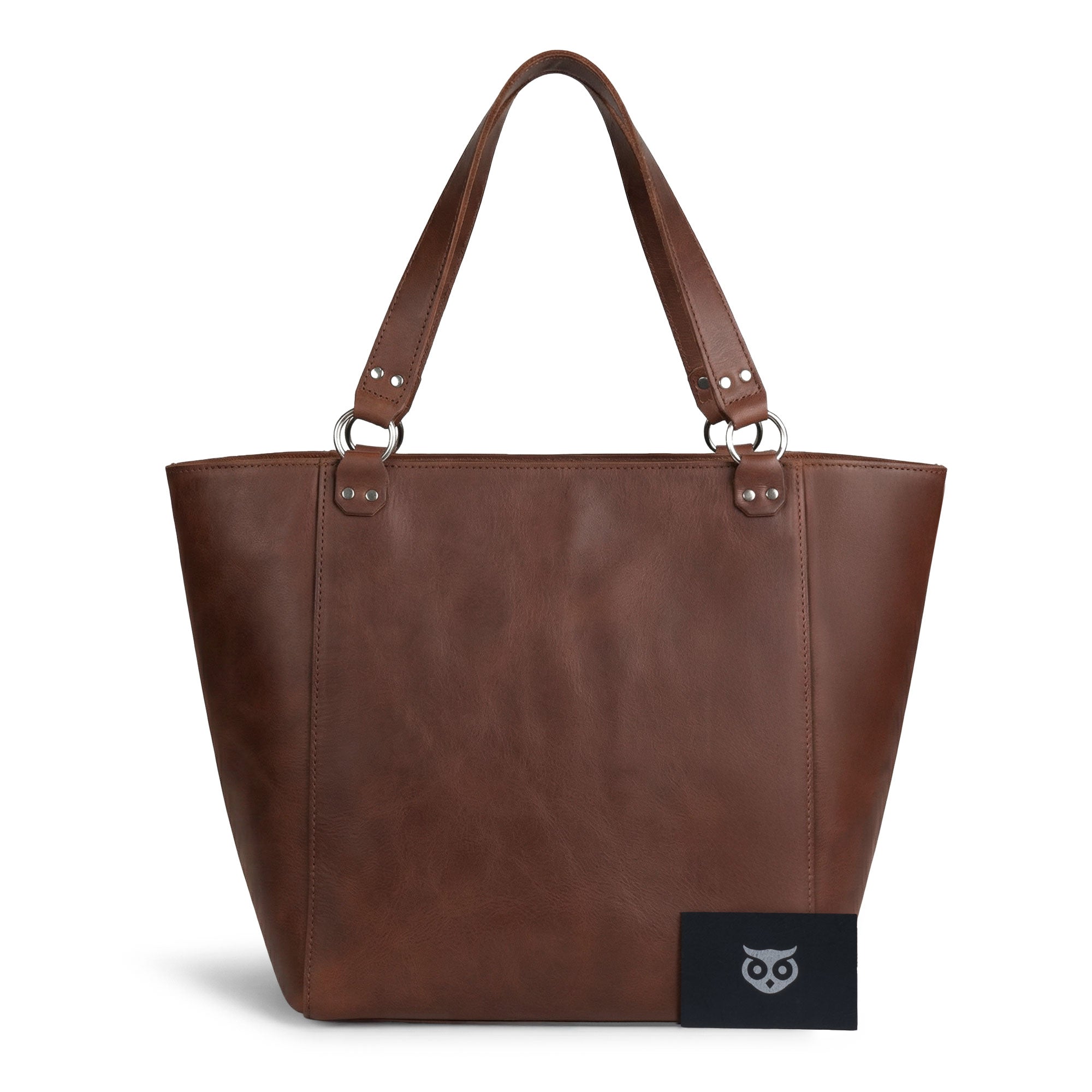 Leather Formal Handbag by Hide & Drink filled with essentials, showcasing its spacious design. This Full Grain Leather bag doubles as a Female Formal Handbag, Shoulder Bag, or Shopping Bag, making it perfect for girls. Handmade in La Antigua Guatemala & Oaxaca Mexico.