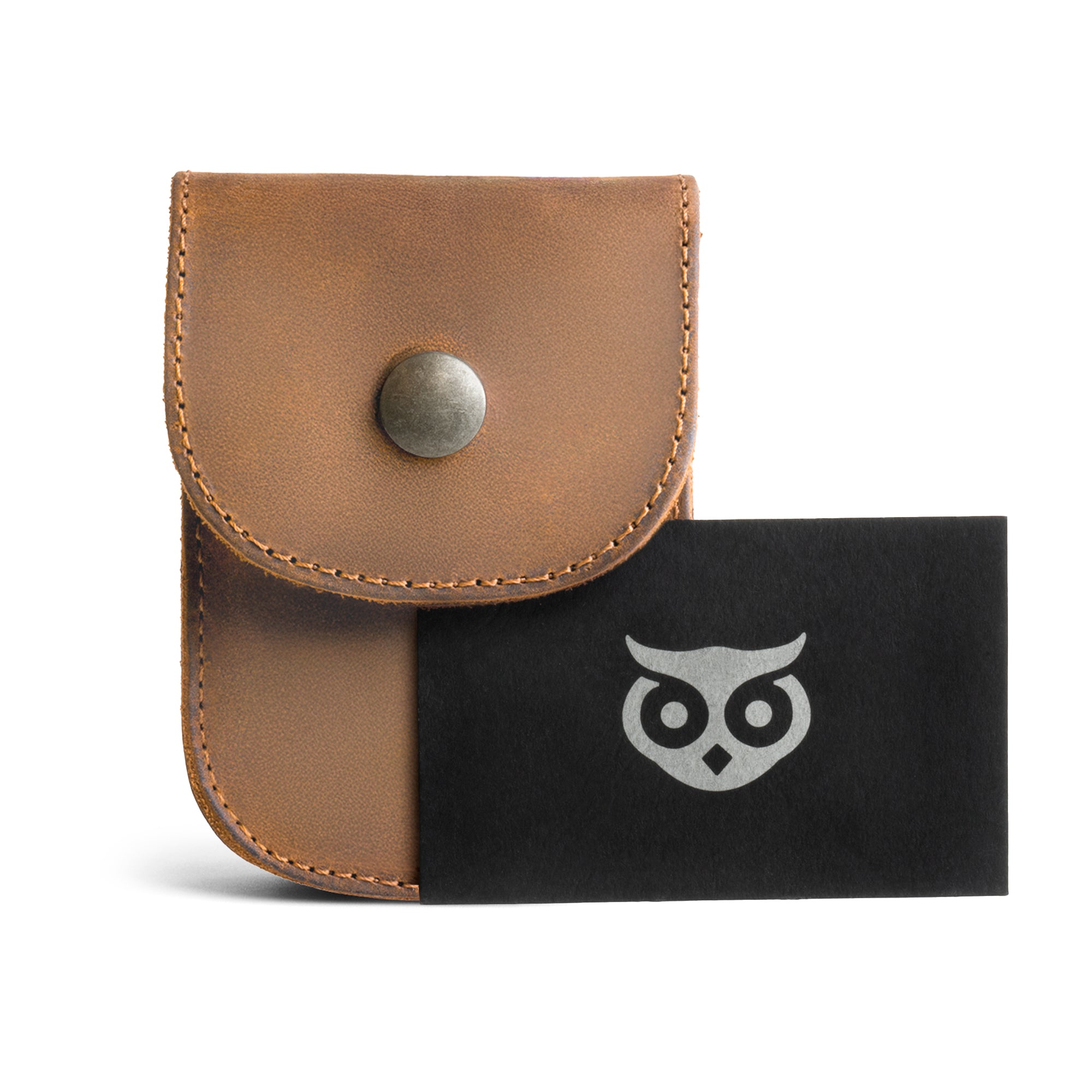 Holster Pouch by Hide & Drink displayed with brand-related items, illustrating its quality craftsmanship. This full grain leather pouch is perfect for organizing personal items and coins, made with care in La Antigua Guatemala.