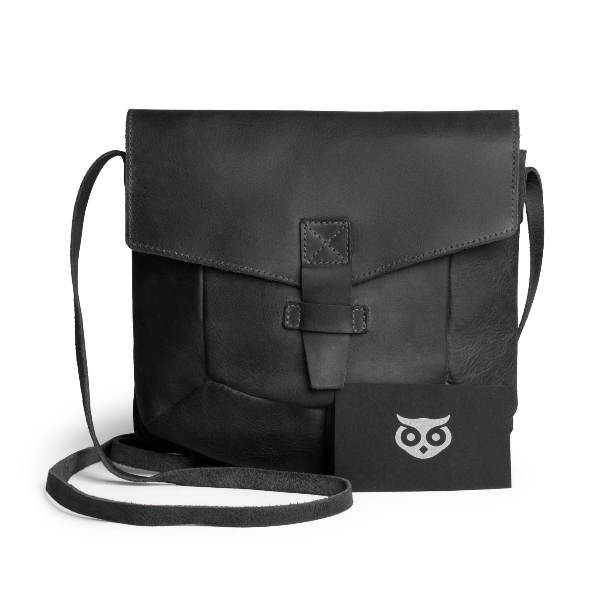 The black Prisma Shoulder Bag, highlighting its enduring style from Hide & Drink. This vintage-inspired purse functions well as a messenger and crossbody bag, made using high-quality full grain leather, showcasing the artisan craftsmanship through hand cut and hand sewn techniques in La Antigua Guatemala & Oaxaca Mexico.