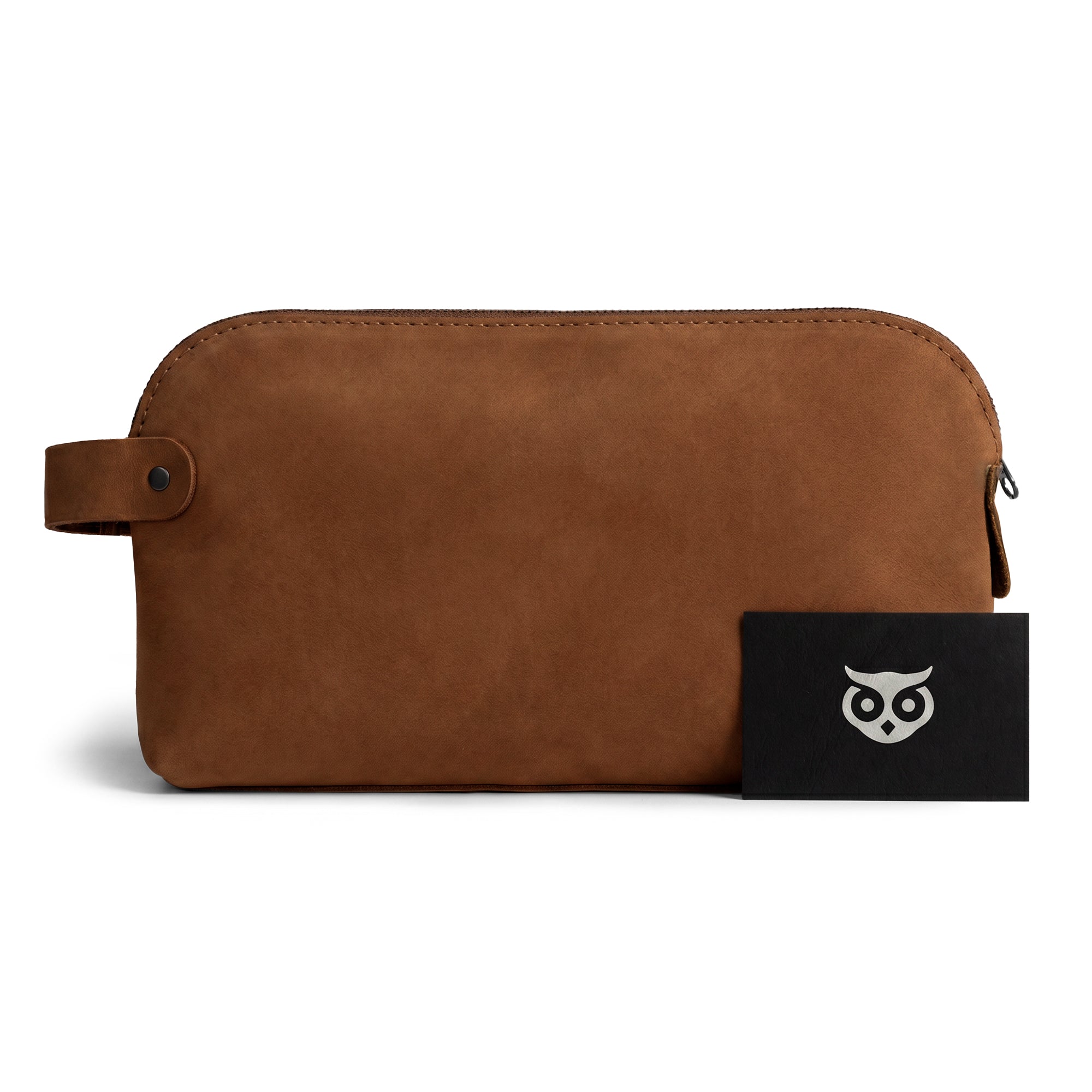 Dopp Kit Utility Bag by Hide & Drink highlighting its modern rustic look and functionality. This large rustic all-purpose Dopp Kit Utility Bag for cords & chargers is artisan crafted with full grain leather, showcasing small batch production and hand cut, hand sewn techniques, handmade in La Antigua Guatemala & Oaxaca Mexico.